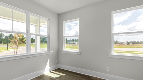 The Marion floorplan features an inviting covered front porch that opens into a formal dining room. The open concept living space is anchored by a spacious kitchen with granite countertops, stainless steel appliances and a large island that overlooks your family and dining room. Ideal for entertaining guests or enjoying family time while preparing meals.