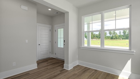 The Marion floorplan features an inviting covered front porch that opens into a formal dining room. The open concept living space is anchored by a spacious kitchen with granite countertops, stainless steel appliances and a large island that overlooks your family and dining room. Ideal for entertaining guests or enjoying family time while preparing meals.