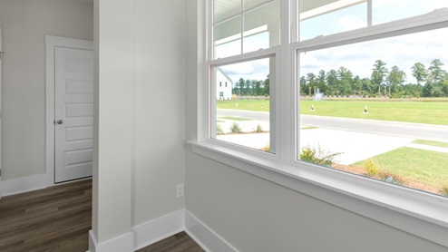 The Marion floorplan features an inviting covered front porch that opens into a formal dining room. The open concept living space is anchored by a spacious kitchen with granite countertops, stainless steel appliances and a large island that overlooks your family and dining room. Ideal for entertaining guests or enjoying family time while preparing meals.