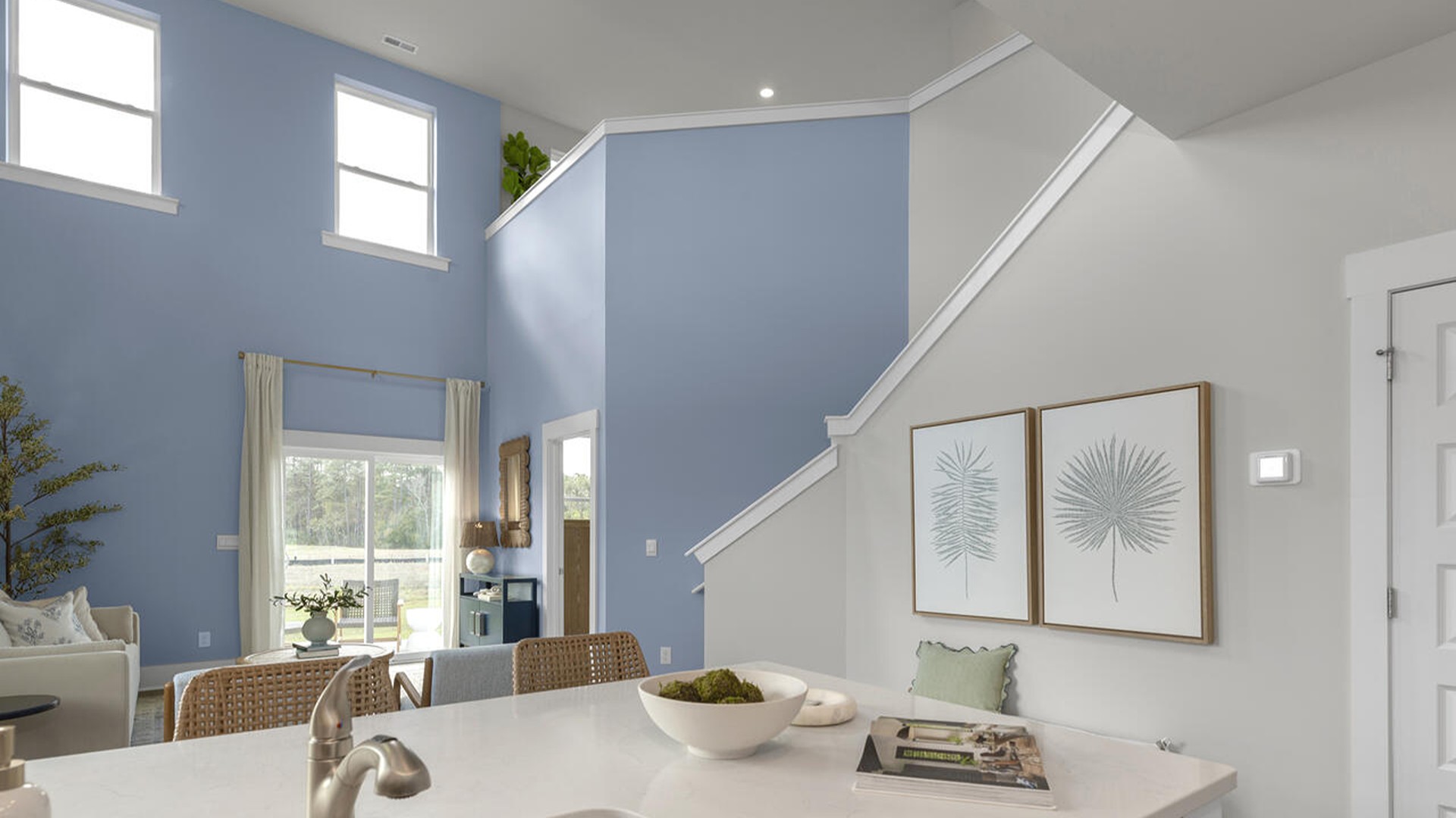 The Marion floorplan features an inviting covered front porch that opens into a formal dining room. The open concept living space is anchored by a spacious kitchen with granite countertops, stainless steel appliances and a large island that overlooks your family and dining room. Ideal for entertaining guests or enjoying family time while preparing meals.