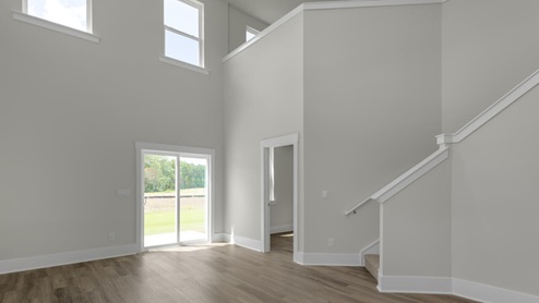 The Marion floorplan features an inviting covered front porch that opens into a formal dining room. The open concept living space is anchored by a spacious kitchen with granite countertops, stainless steel appliances and a large island that overlooks your family and dining room. Ideal for entertaining guests or enjoying family time while preparing meals.