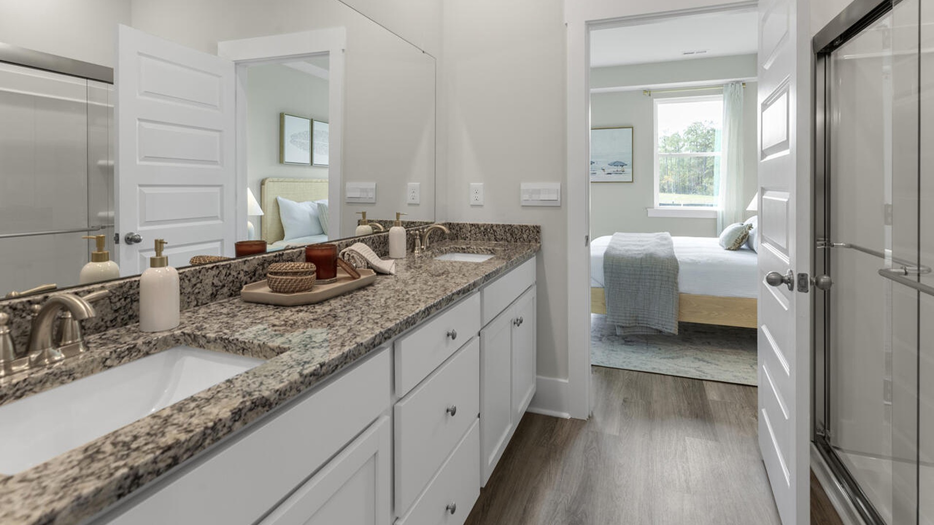 The first-floor primary bedroom boasts a large bath, double vanities and walk-in closet and convenient laundry room. On the second floor, you are greeted by a versatile loft space, two secondary bedrooms, laundry and a full bath.