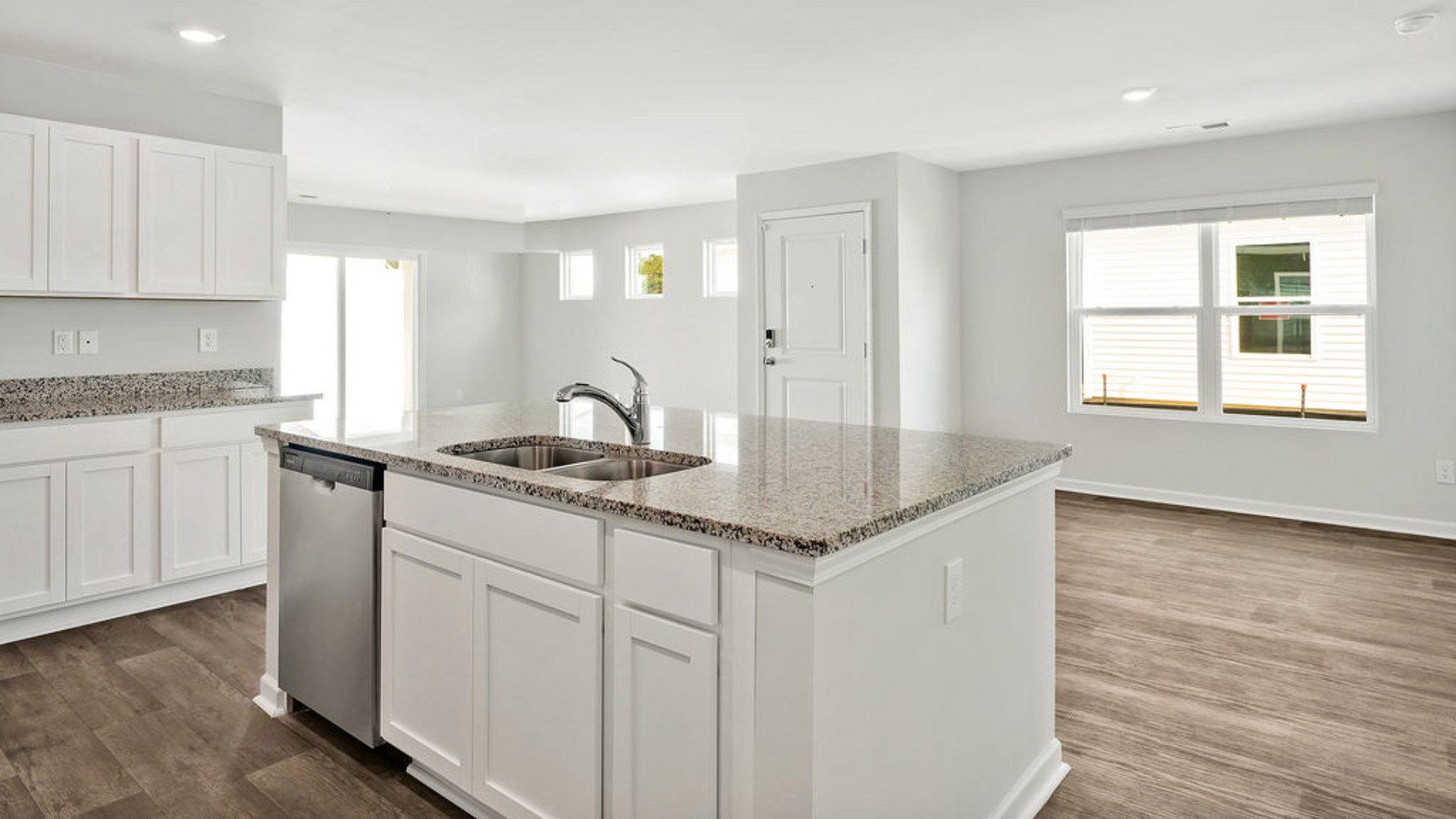 The kitchen features granite countertops, and stainless steel appliances, which are sure to both turn heads and make meal prep easy. You’ll never be too far from the action with the living and dining area right there.