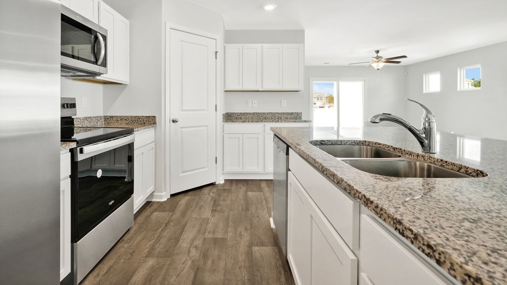 The kitchen features granite countertops, and stainless steel appliances, which are sure to both turn heads and make meal prep easy. You’ll never be too far from the action with the living and dining area right there.