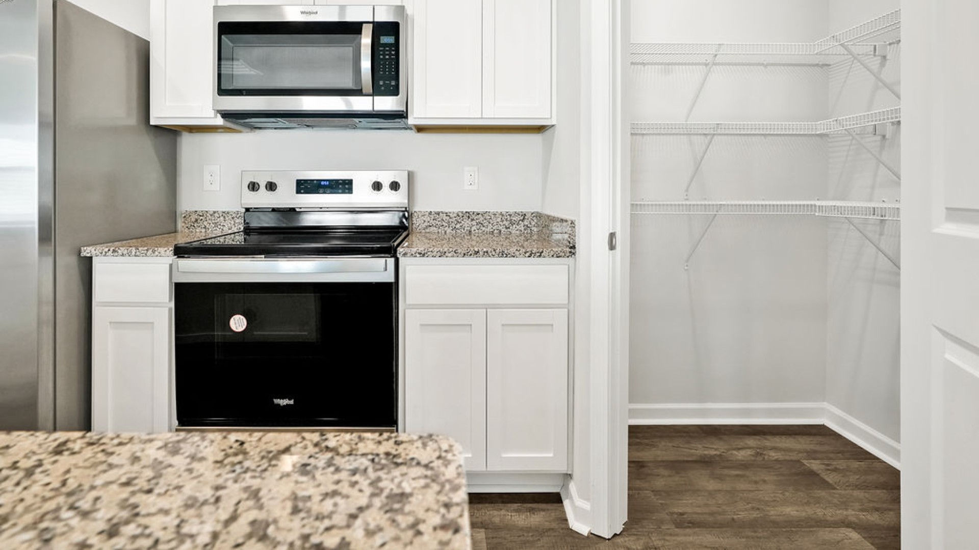 The kitchen features granite countertops, and stainless steel appliances, which are sure to both turn heads and make meal prep easy. You’ll never be too far from the action with the living and dining area right there.