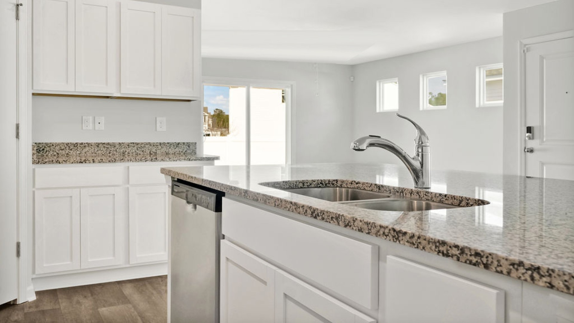 The kitchen features granite countertops, and stainless steel appliances, which are sure to both turn heads and make meal prep easy. You’ll never be too far from the action with the living and dining area right there.