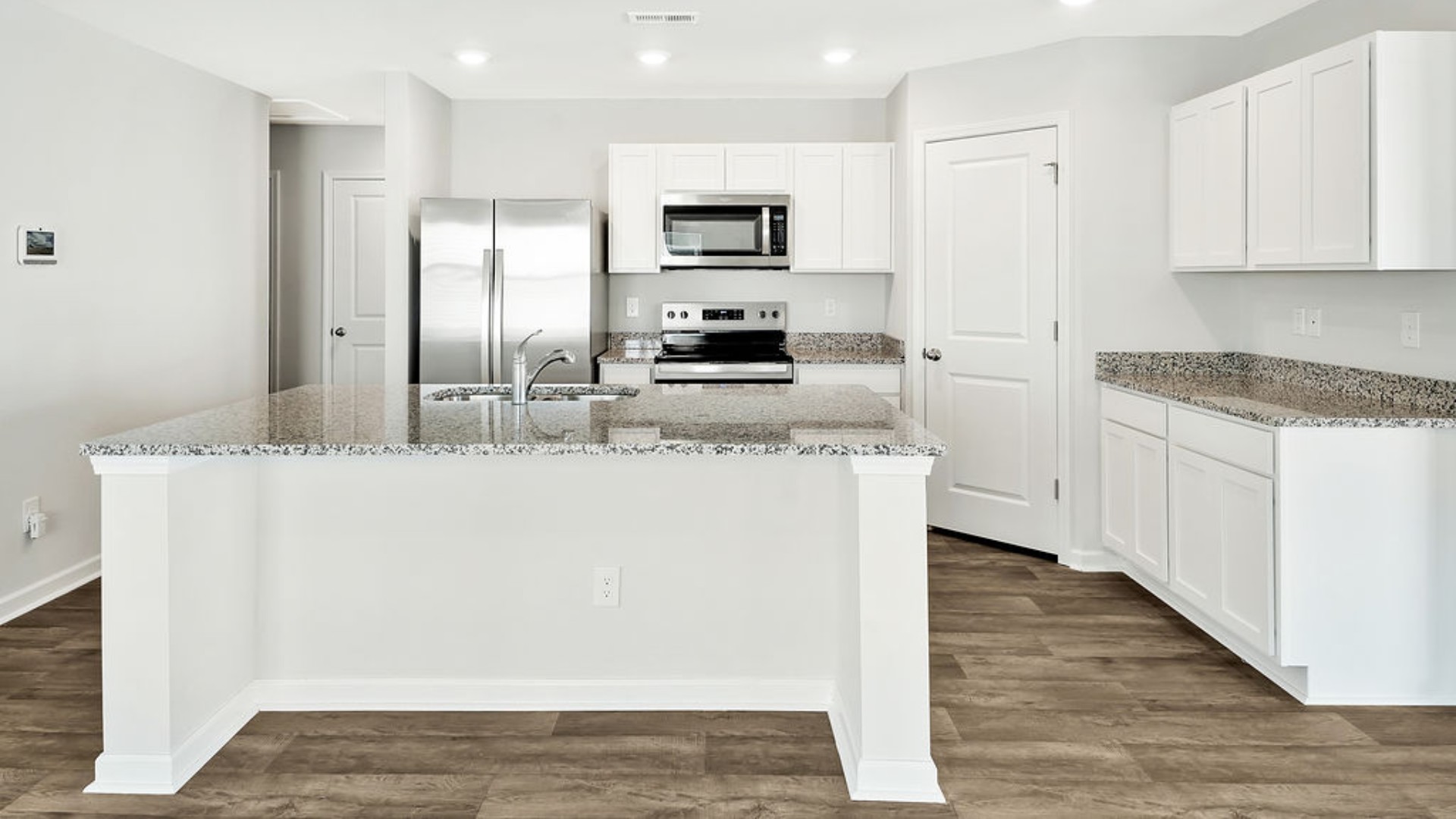 The kitchen features granite countertops, and stainless steel appliances, which are sure to both turn heads and make meal prep easy. You’ll never be too far from the action with the living and dining area right there.