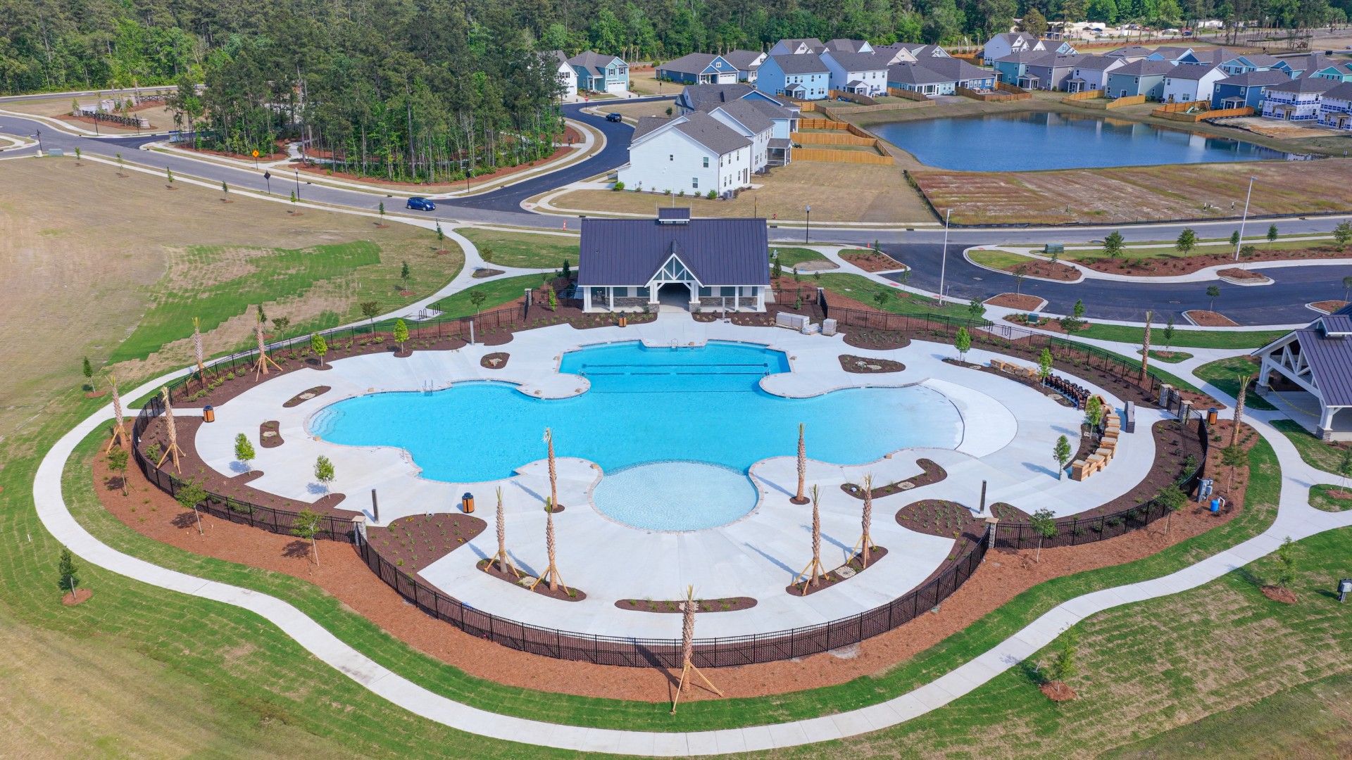 The Amenity Center includes a resort-style pool, clubhouse with kitchen, playground, pickleball courts, fire pit, and pocket park.