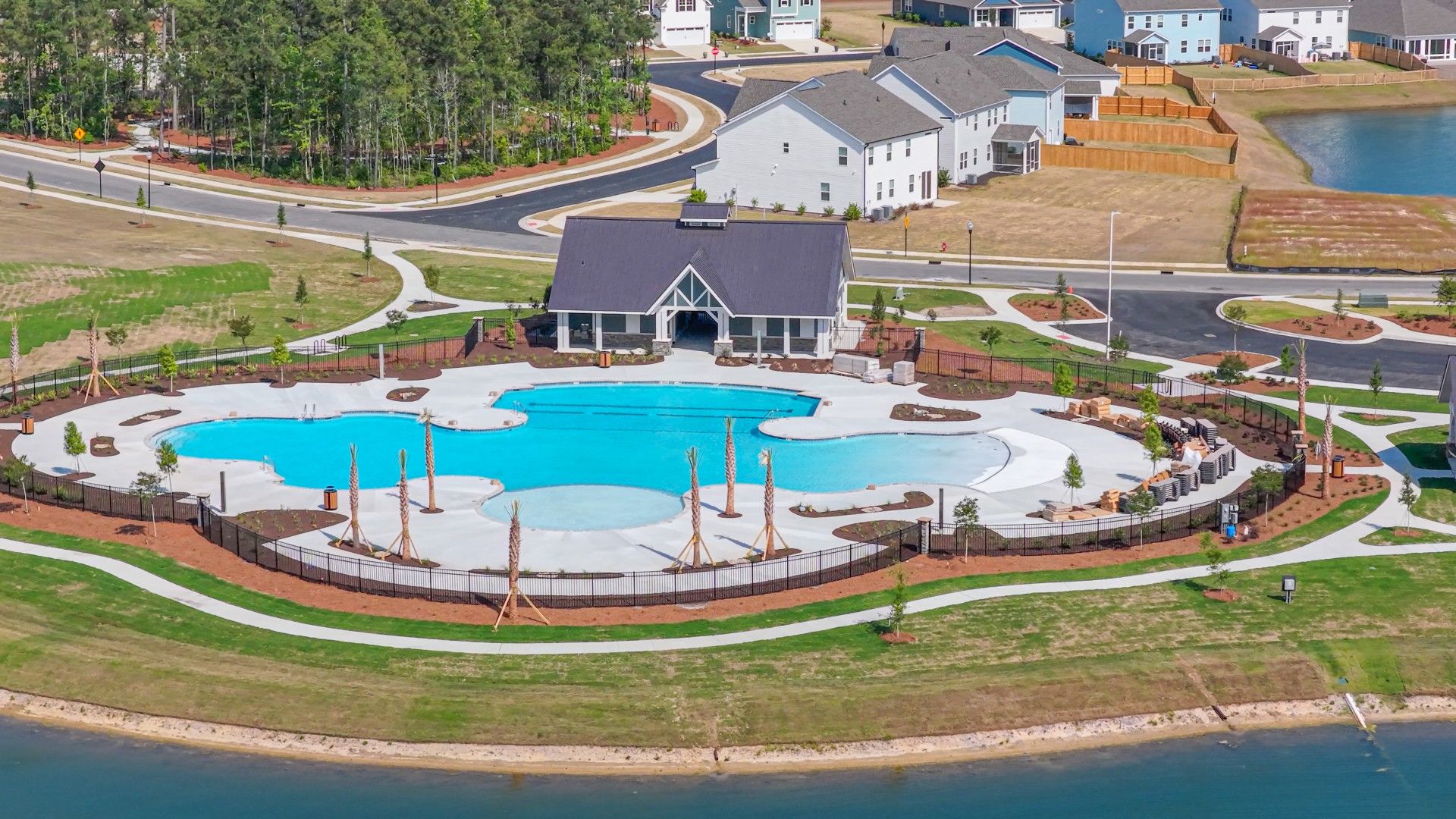 The Amenity Center includes a resort-style pool, clubhouse with kitchen, playground, pickleball courts, fire pit, and pocket park.