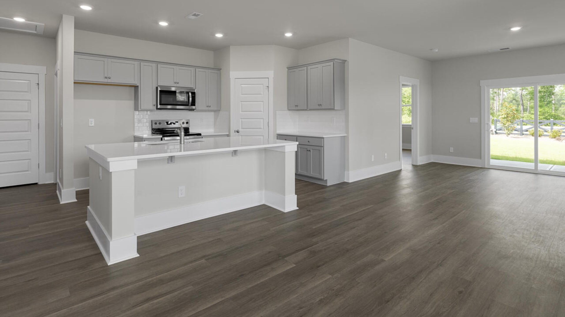 The kitchen features granite countertops, and stainless steel appliances, which are sure to both turn heads and make meal prep easy. You’ll never be too far from the action with the living and dining area right there.
