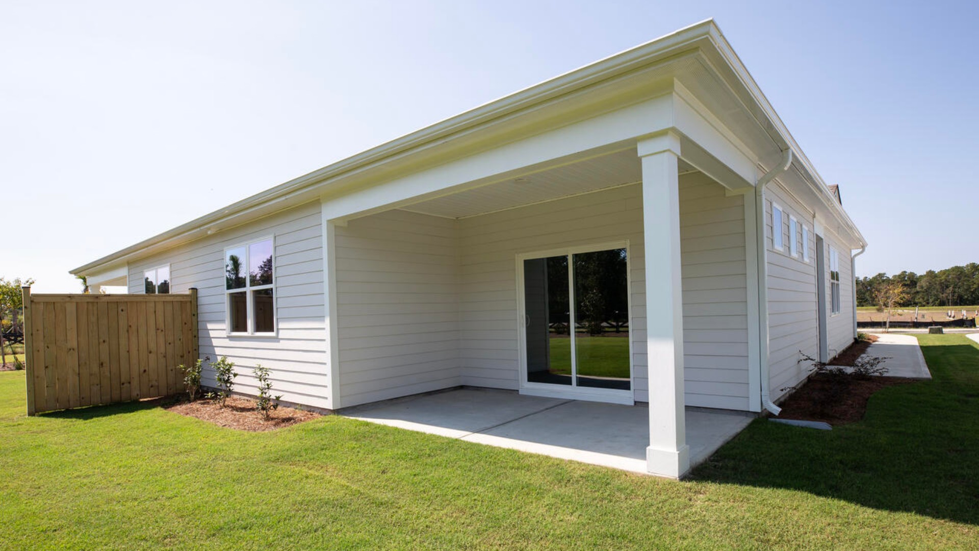 The Aria is a 3-bedroom, 2-bathroom home with 1,618 square feet of open living space. Its centerpiece is the showstopper kitchen, featuring a large island, stainless steel appliances, and a spacious pantry. This one-level floor plan is perfect for entertaining or relaxing in style. The Primary Suite offers a massive closet and a luxurious bathroom with a walk-in shower, linen closet, and dual vanity. With its open layout and sleek design, the Aria is ideal for anyone seeking comfort and modern features. Enjoy the covered porch perfect for entertaining and enjoying the Carolina evenings.