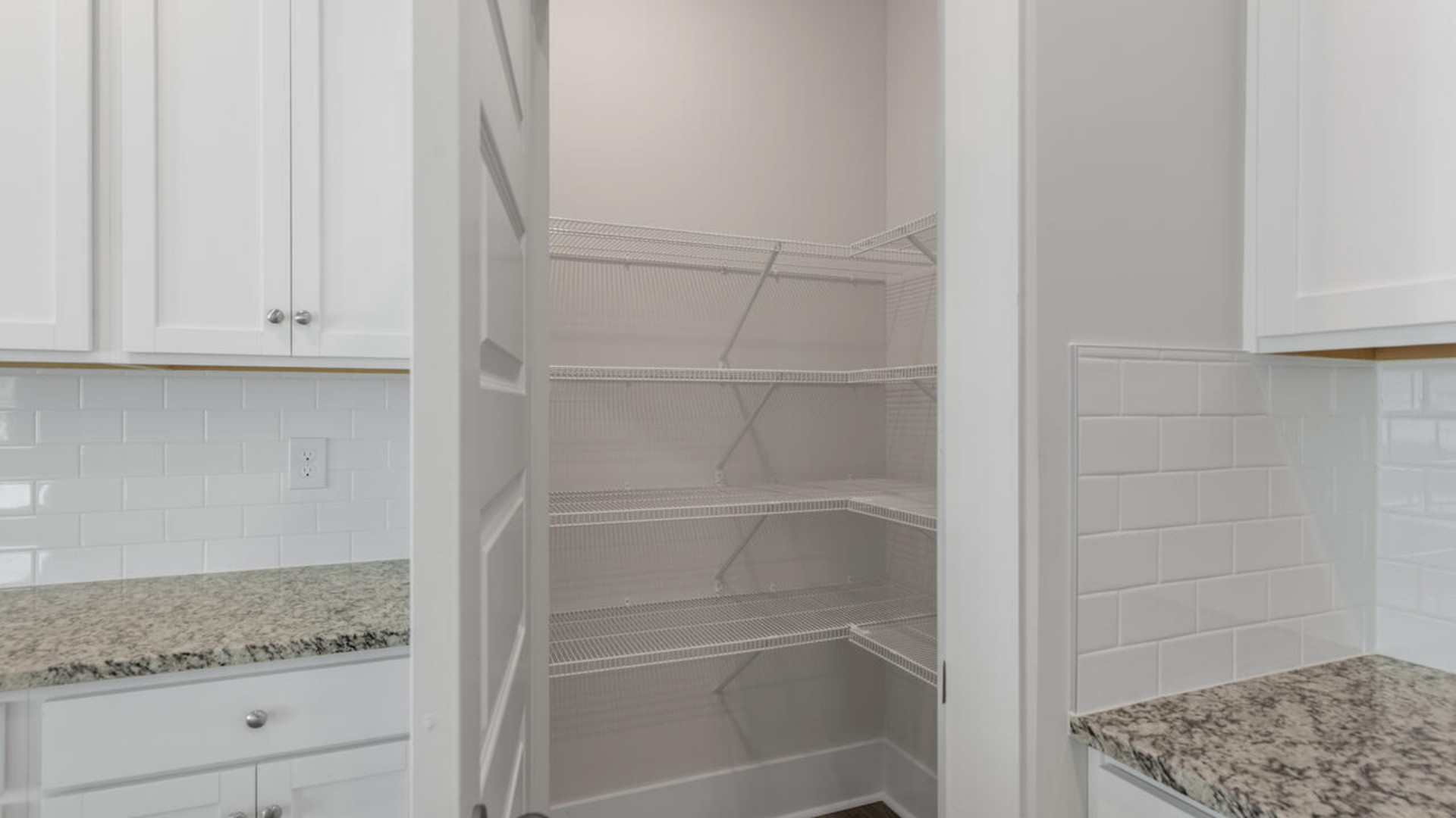 The kitchen features quartz countertops, and stainless steel appliances, which are sure to both turn heads and make meal prep easy. You’ll never be too far from the action with the living and dining area right there.