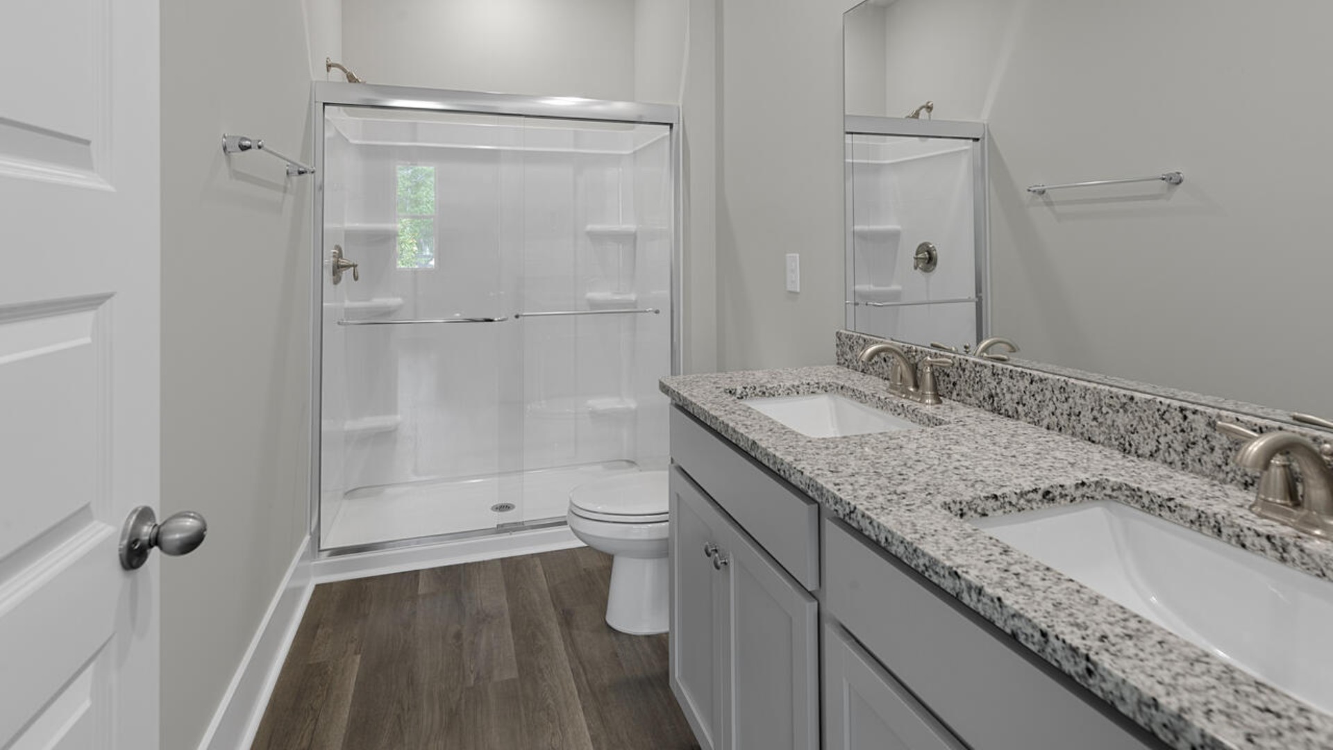 The primary bedroom has its own attached bathroom that features a walk-in closet and all the space you need to get ready in the morning