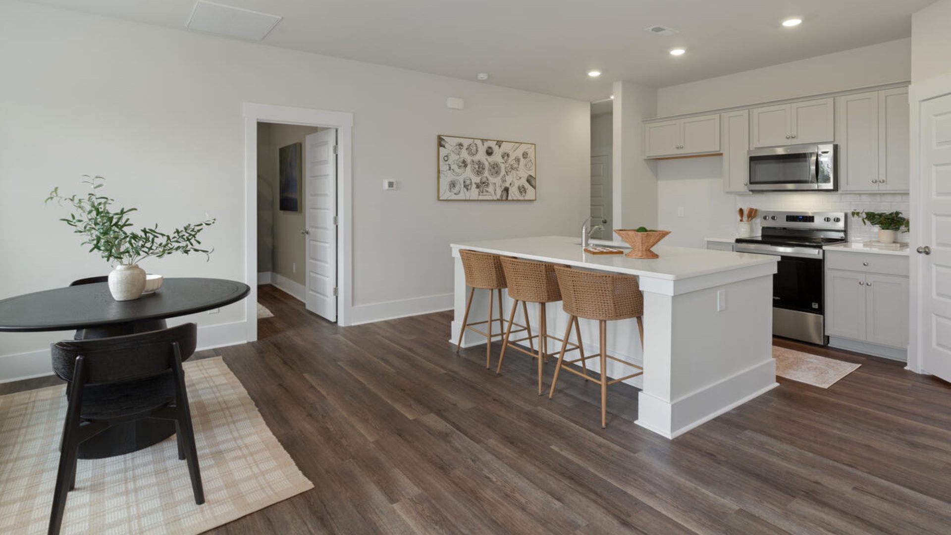 The kitchen features granite countertops, and stainless steel appliances, which are sure to both turn heads and make meal prep easy. You’ll never be too far from the action with the living and dining area right there.