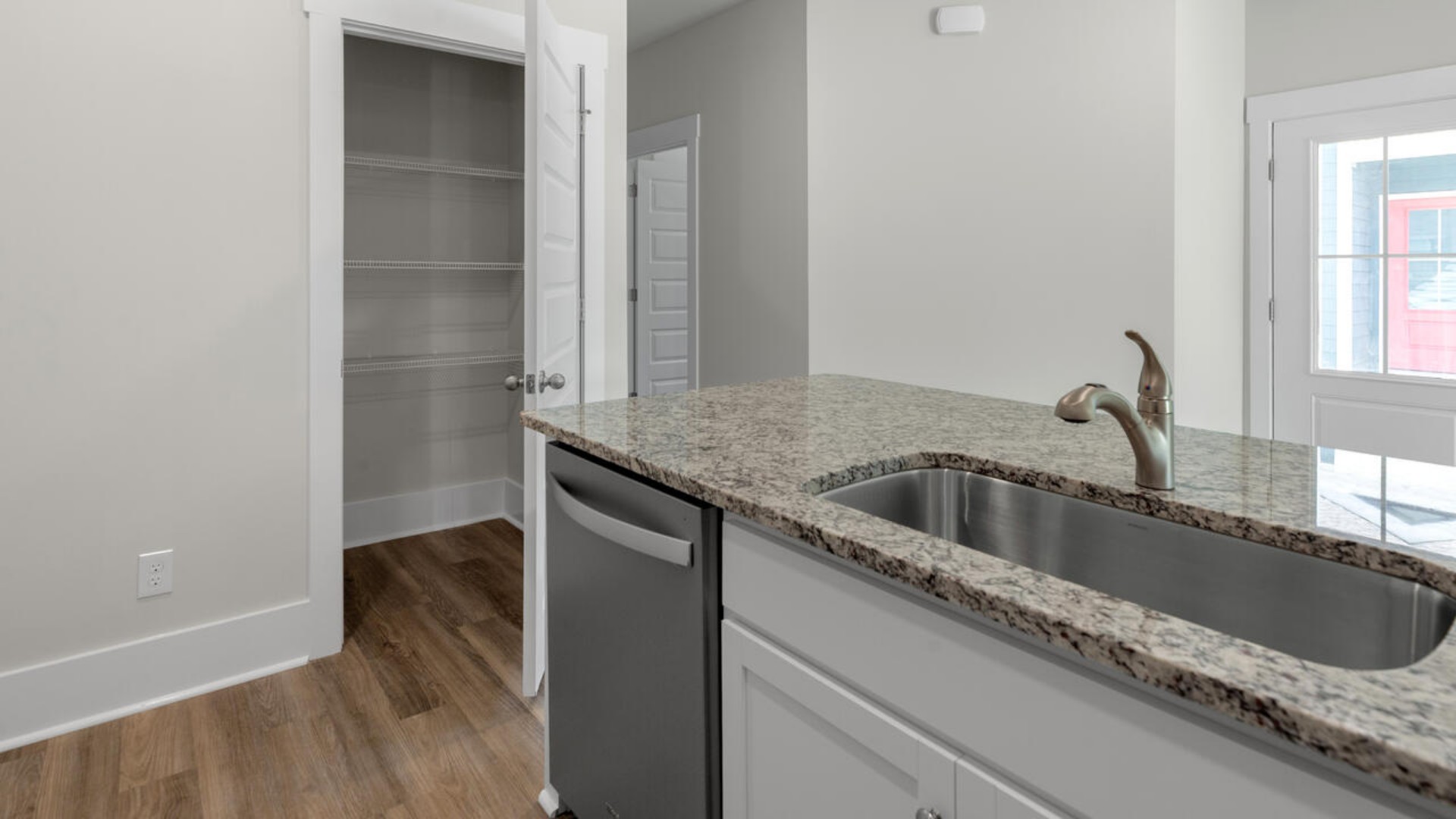 The open-concept layout seamlessly connects the kitchen, dining, and living areas making it ideal for entertaining or everyday relaxation. The kitchen and bathrooms boast elegant granite countertops for both durability and style.