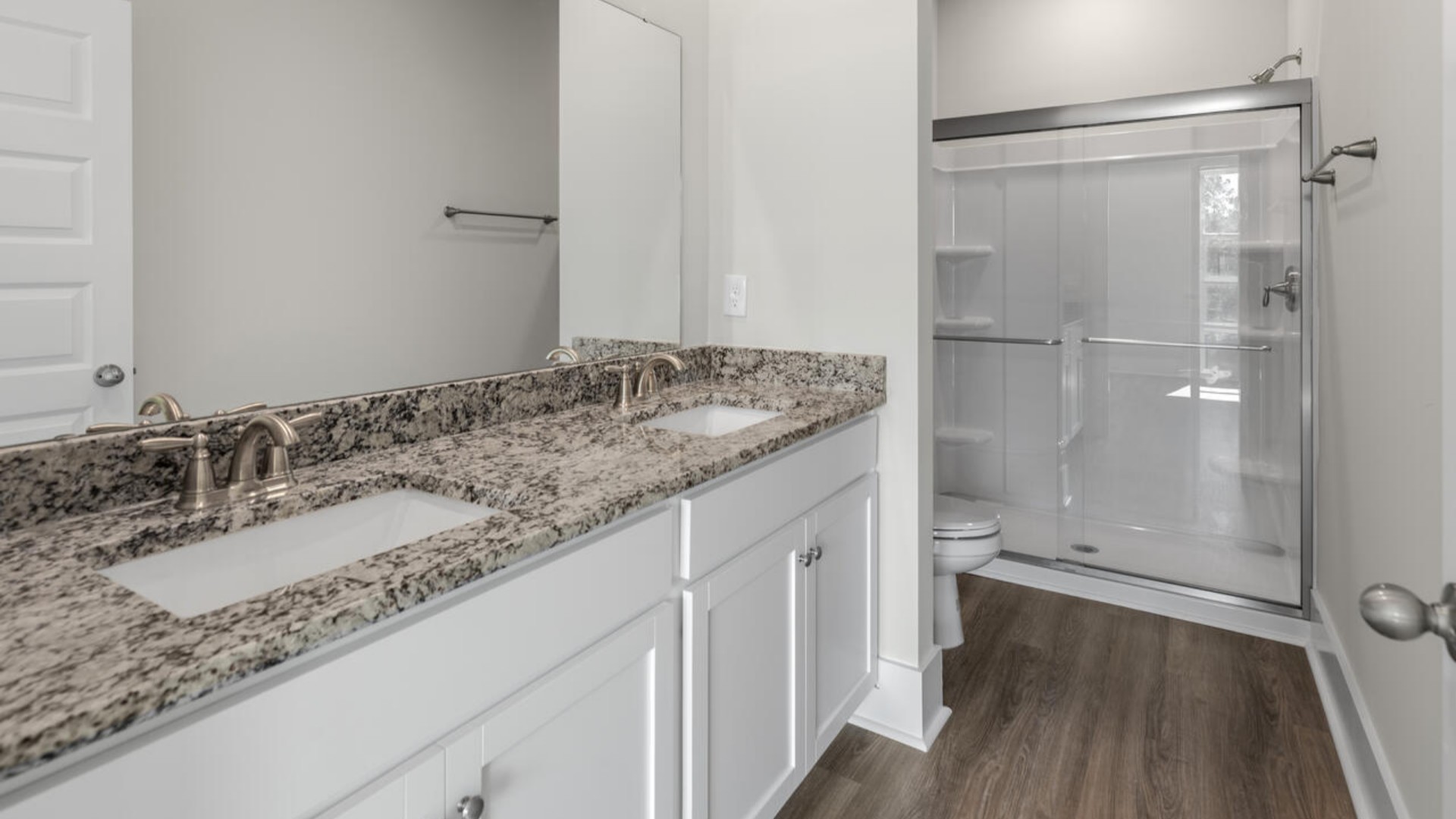 The primary bedroom has its own attached bathroom that features a walk-in closet and all the space you need to get ready in the morning.