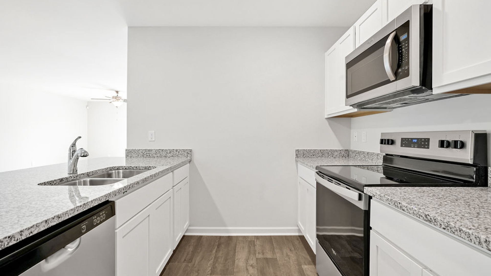 The kitchen features granite countertops, and stainless-steel appliances, which are sure to both turn heads and make meal prep easy. You’ll never be too far from the action with the living and dining area right there.