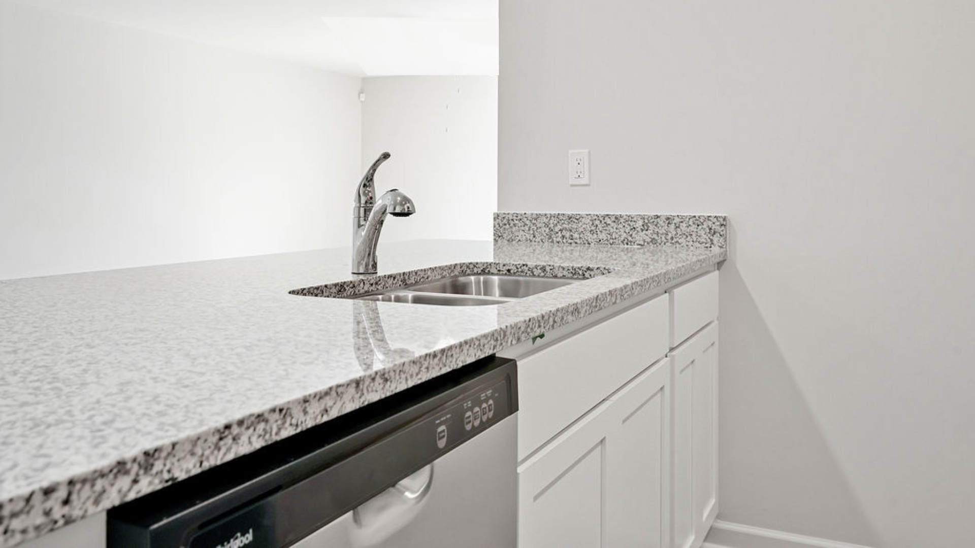 The kitchen features granite countertops, and stainless-steel appliances, which are sure to both turn heads and make meal prep easy. You’ll never be too far from the action with the living and dining area right there.