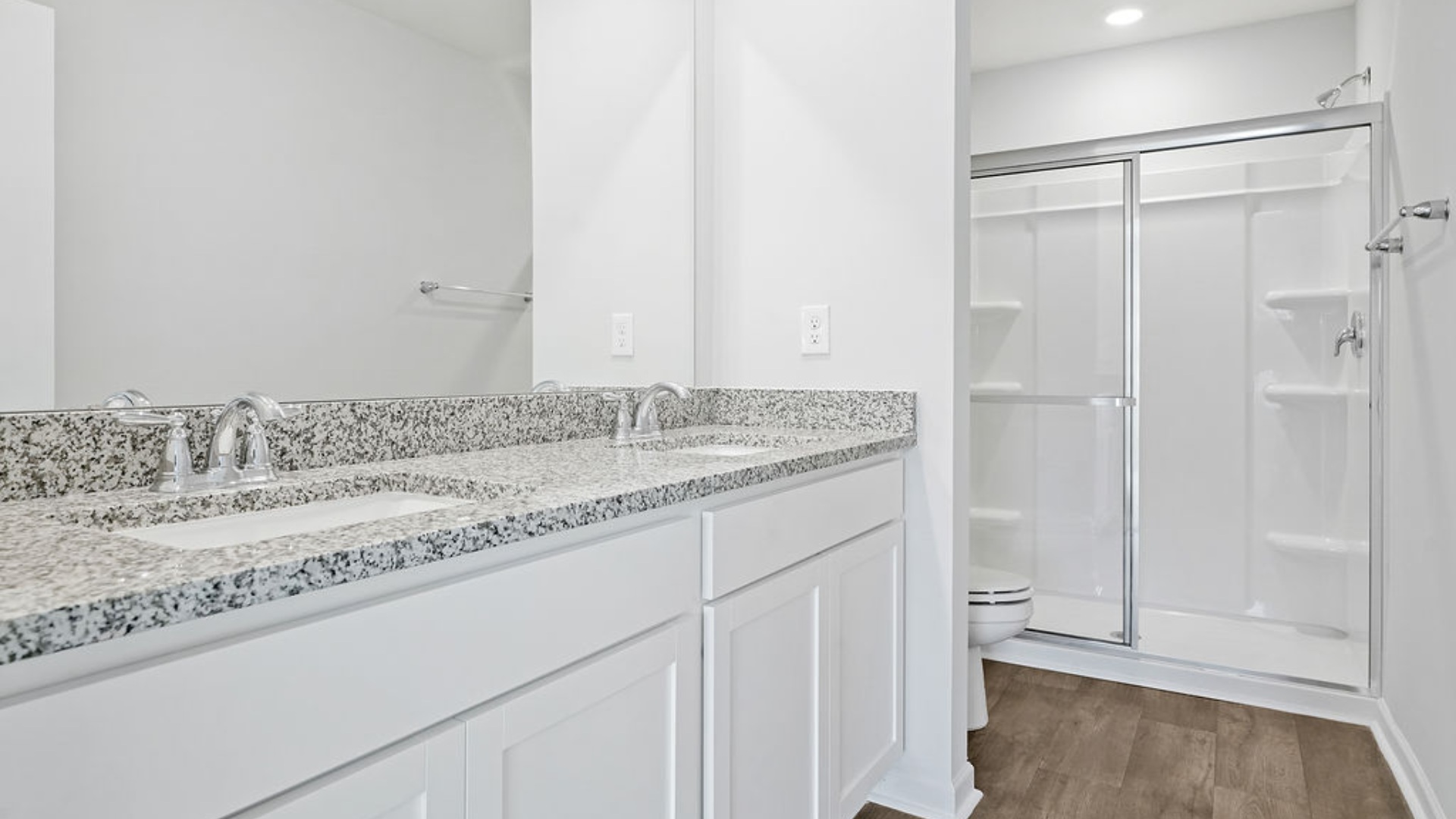 The primary bedroom has its own attached bathroom that features a walk-in closet and all the space you need to get ready in the morning. S