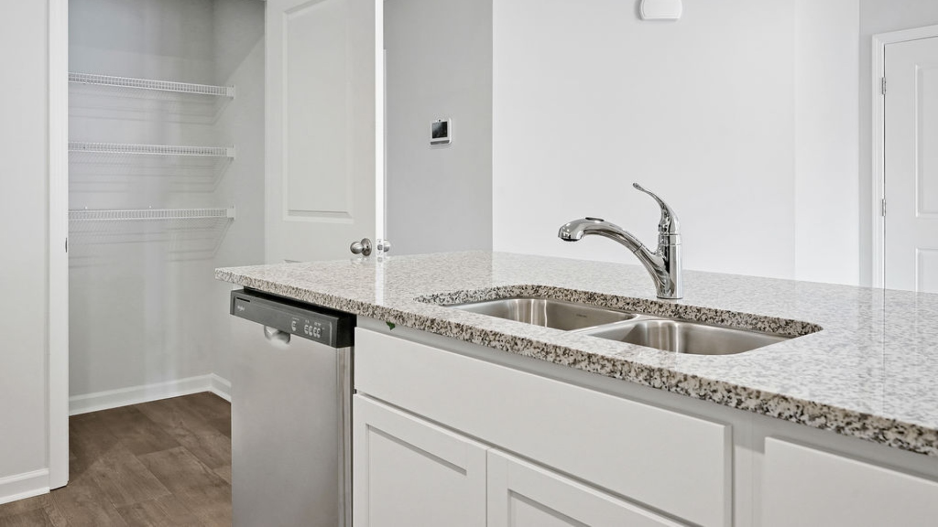 The kitchen features granite countertops, and stainless-steel appliances, which are sure to both turn heads and make meal prep easy. You’ll never be too far from the action with the living and dining area right there.