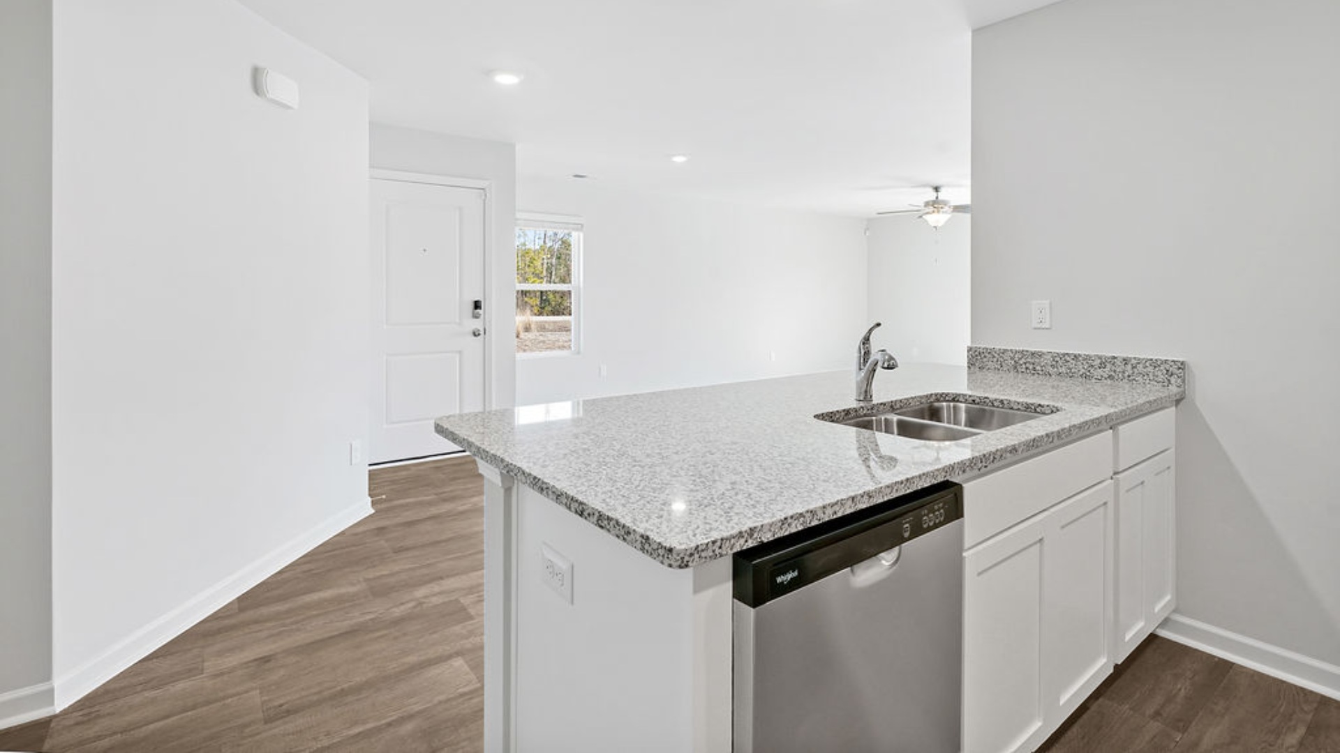 The kitchen features granite countertops, and stainless-steel appliances, which are sure to both turn heads and make meal prep easy. You’ll never be too far from the action with the living and dining area right there.
