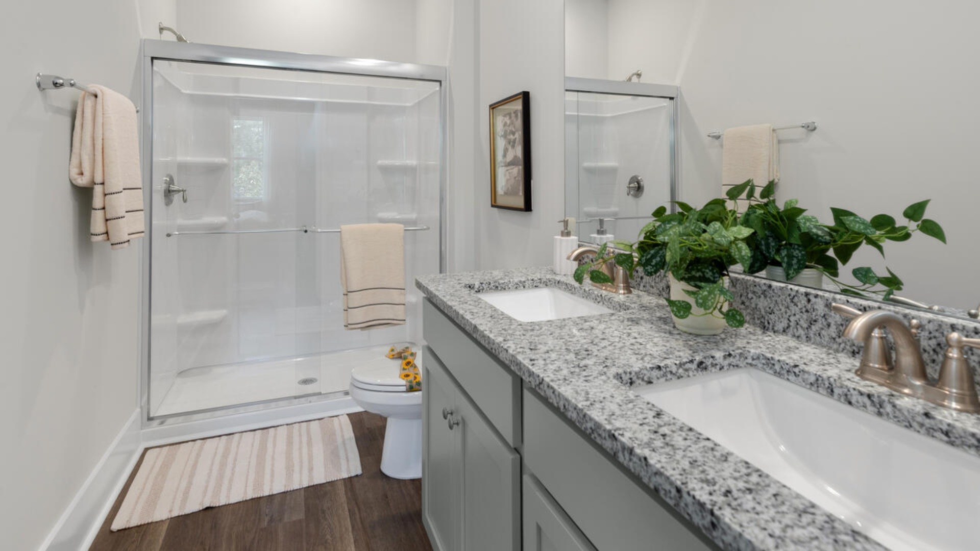 The primary bedroom has its own attached bathroom that features a walk-in closet and all the space you need to get ready in the morning. Sharing a sink isn’t a worry with the double vanity, and you also get additional privacy with a separate door for the toilet and shower.