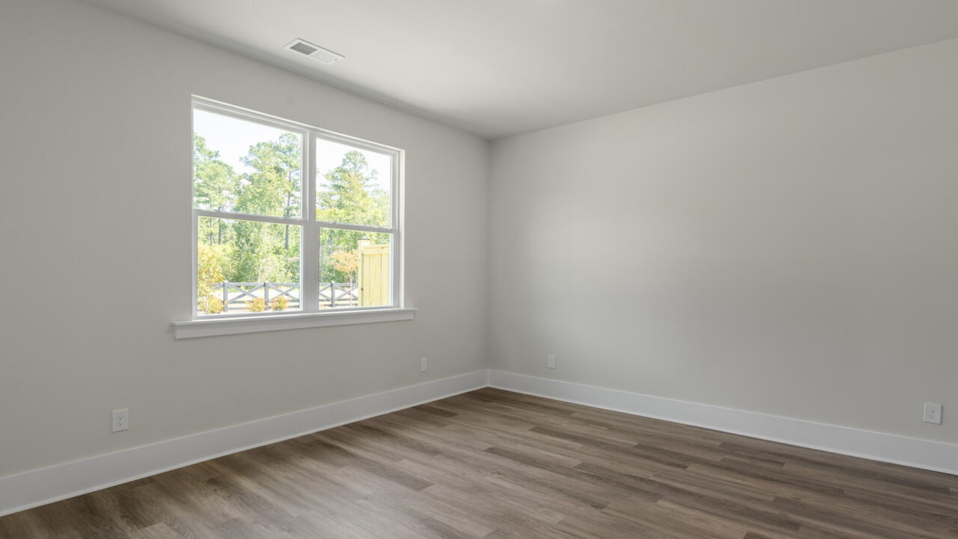 The primary bedroom has its own attached bathroom that features a walk-in closet and all the space you need to get ready in the
