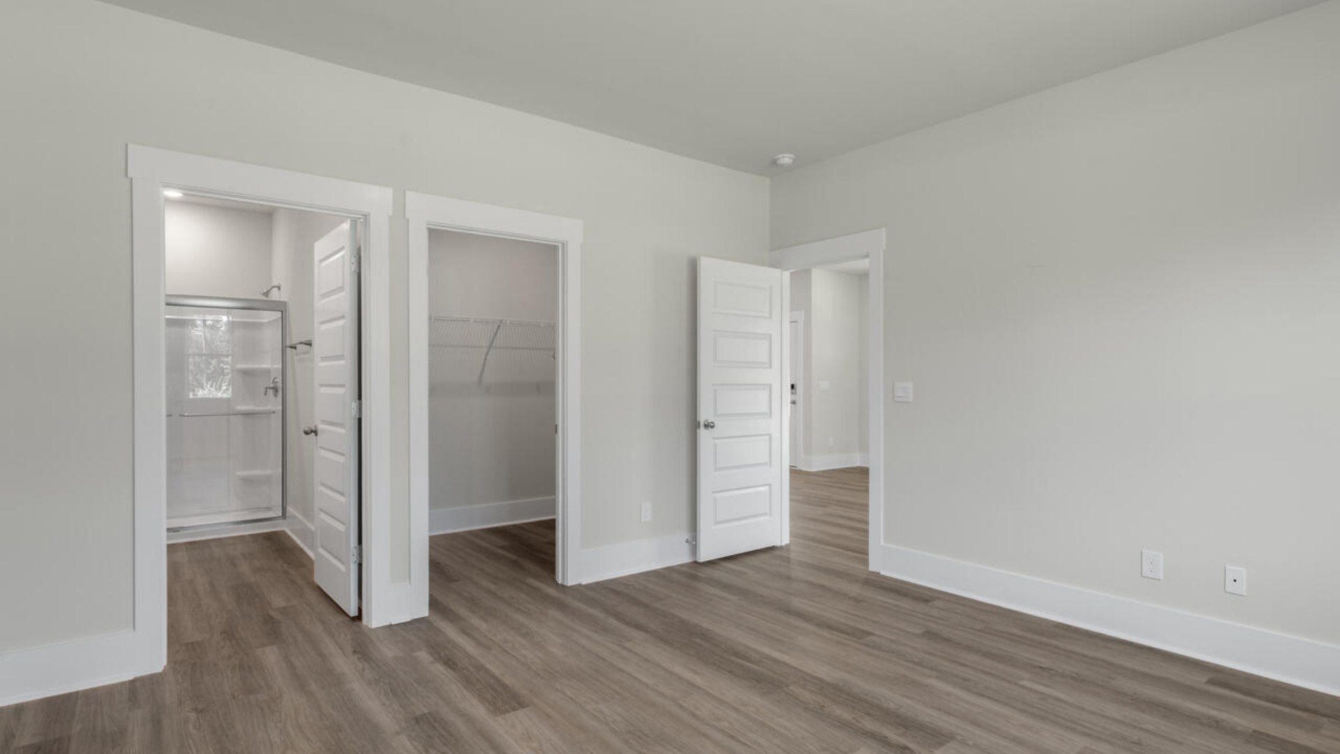 The primary bedroom has its own attached bathroom that features a walk-in closet and all the space you need to get ready in the