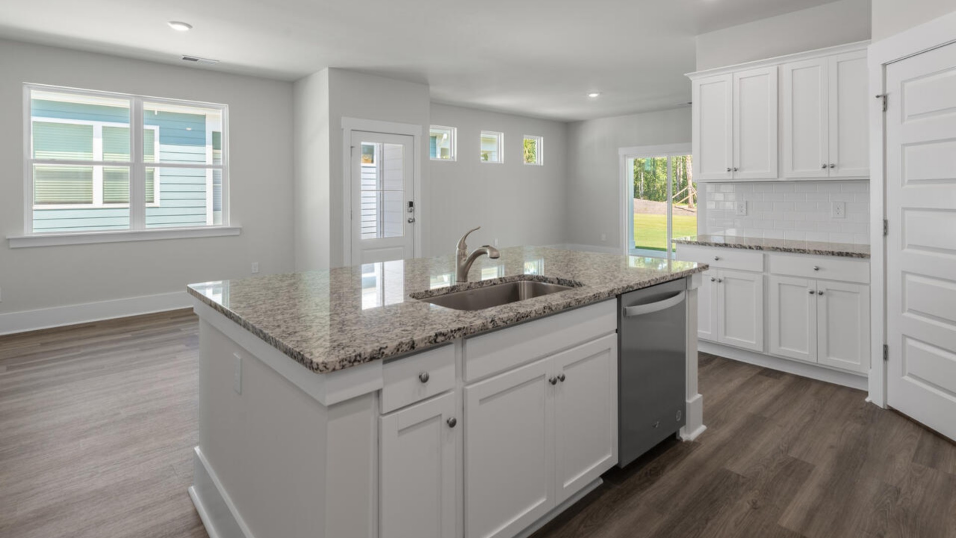 The kitchen features granite countertops, and stainless-steel appliances, which are sure to both turn heads and make meal prep easy. You’ll never be too far from the action with the living and dining area right there.