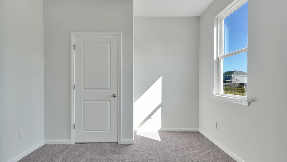 The home features a primary suite with a walk-in closet and an en suite bathroom featuring a shower with dual vanities. The additional three bathrooms are spacious and have access to a secondary bathroom.