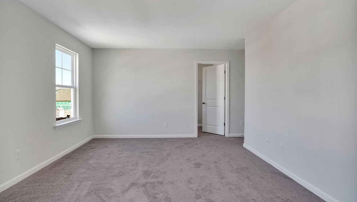 The home features a primary suite with a walk-in closet and an en suite bathroom featuring a shower with dual vanities. The additional three bathrooms are spacious and have access to a secondary bathroom.