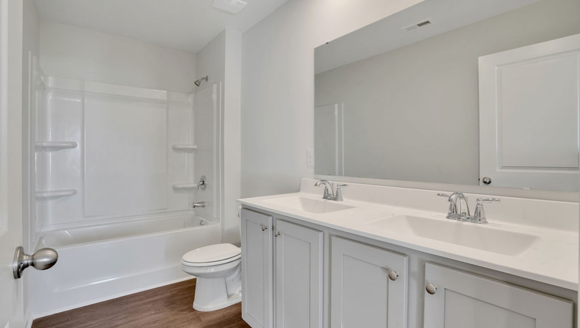 The additional three bathrooms are spacious and have access to a secondary bathroom. The loft offers a flexible media room, playroom, or home gym space. The laundry room completes the second floor.