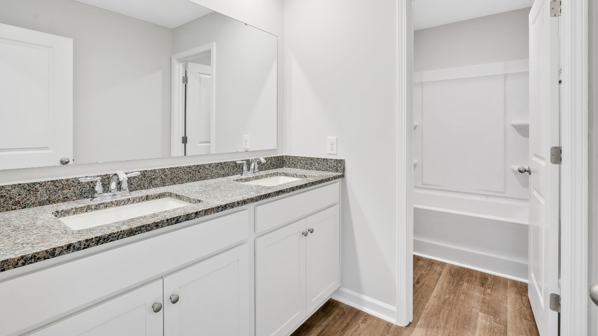 The primary bedroom has its own attached bathroom that features a walk-in closet and all the space you need to get ready in the morning. Sharing a sink isn’t a worry with the double vanity, and you also get additional privacy with a separate door for the toilet and shower.