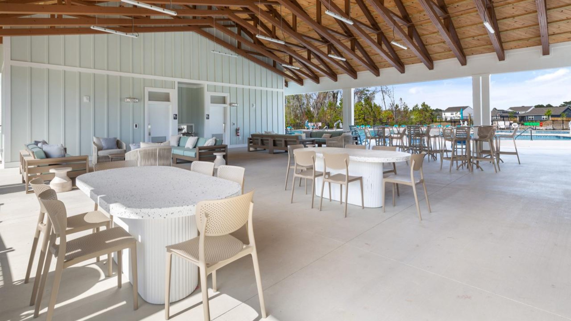 The amenity center that includes a swimming pool, multi-sport court, splashpad, playground, and fire pit, ensuring a well-rounded and enjoyable living experience.