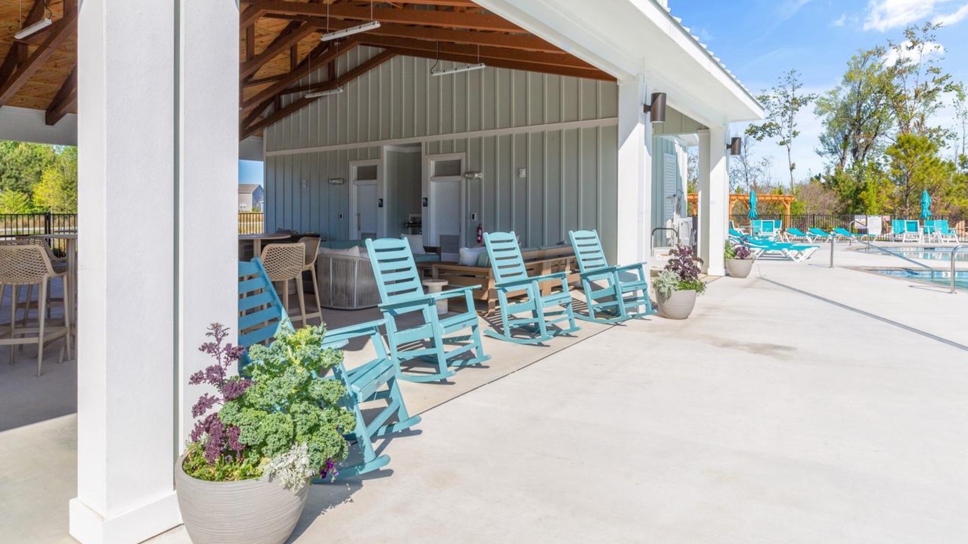 The amenity center that includes a swimming pool, multi-sport court, splashpad, playground, and fire pit, ensuring a well-rounded and enjoyable living experience.