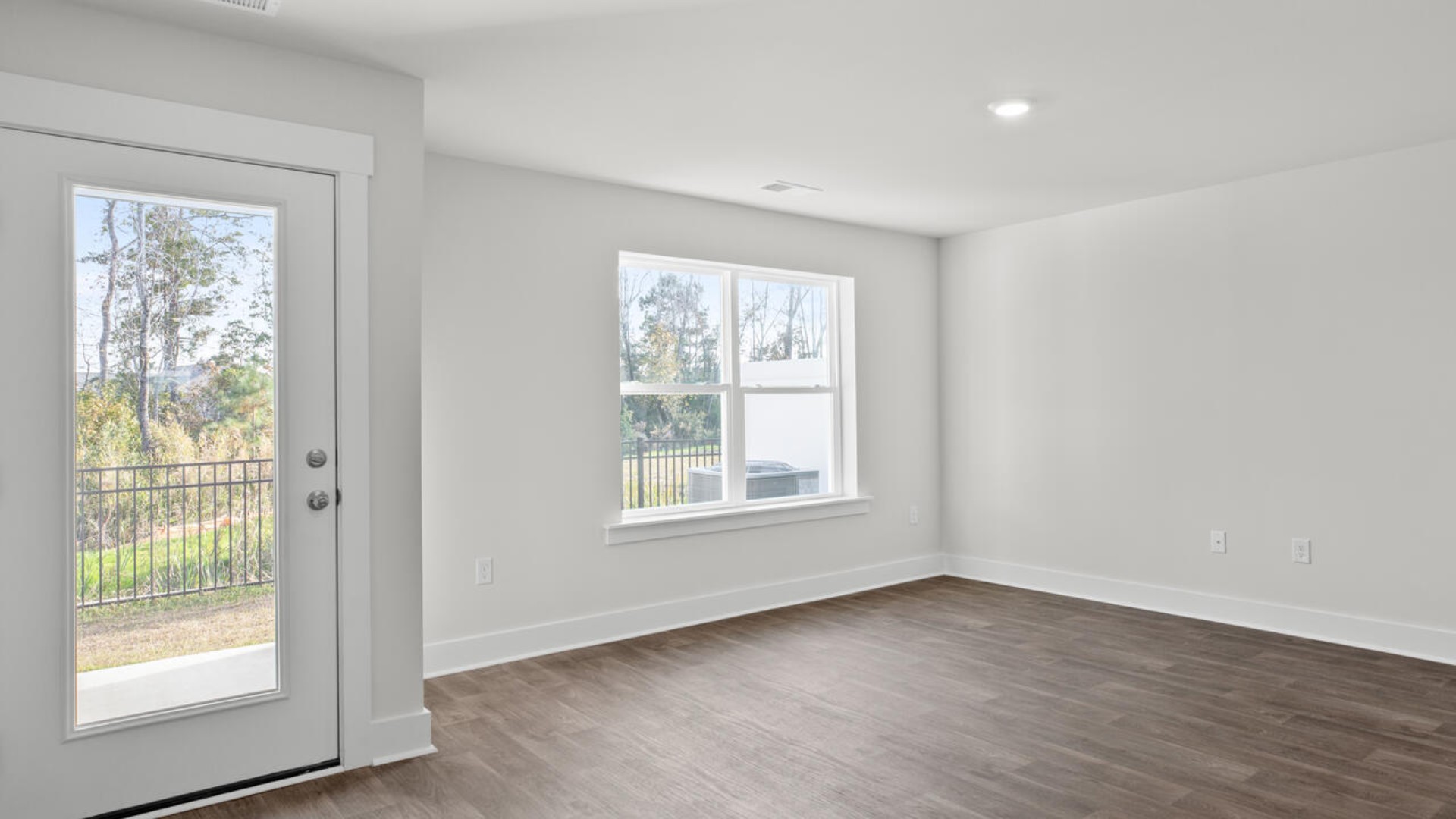 The kitchen overlooks the dining and living spaces, ideal for entertaining guests or enjoying family time while preparing meals with new stainless-steel appliances, walk-in pantry and granite countertops.