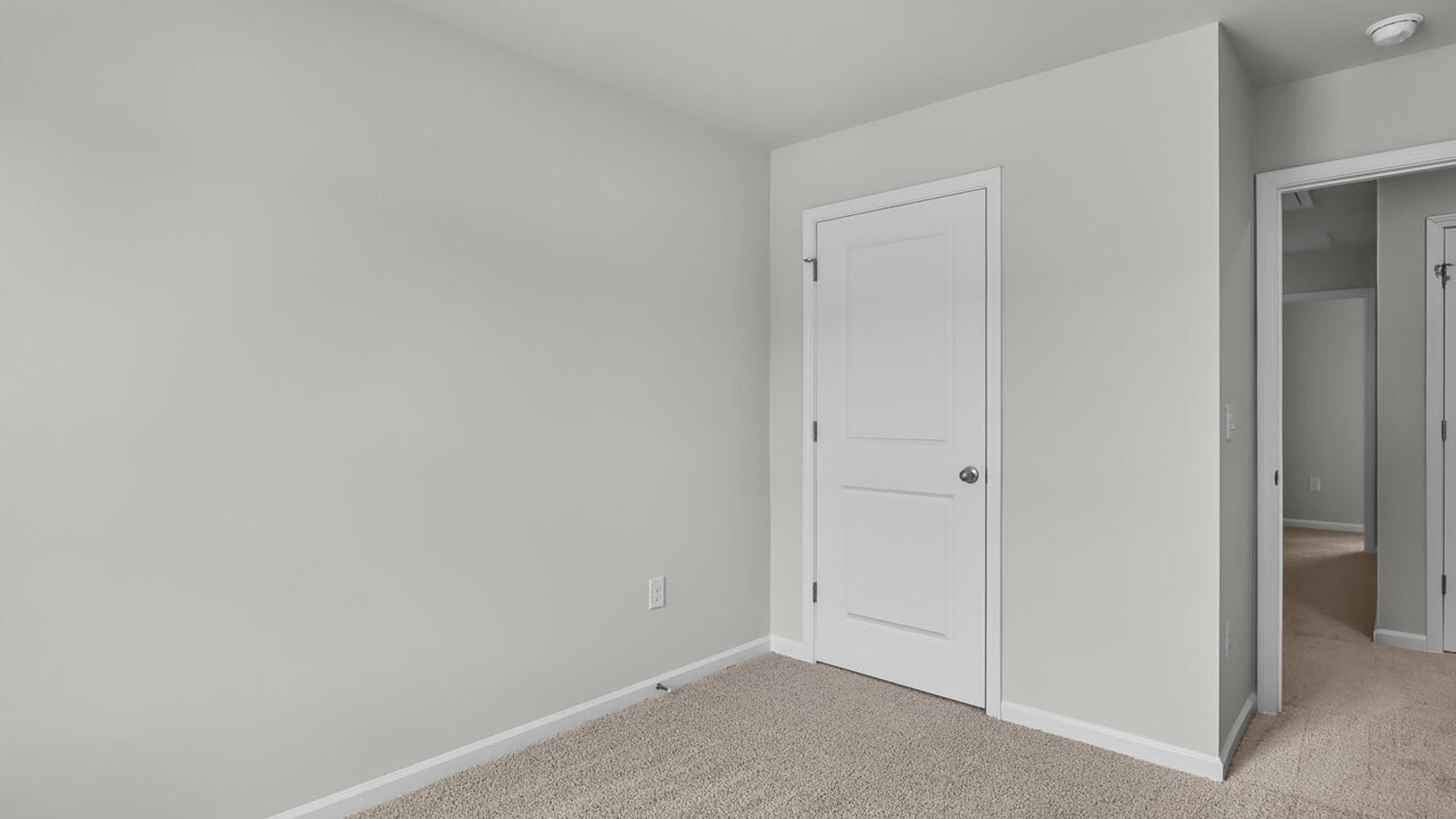 The second floor features the primary bedroom with a walk-in closet and double vanities. It also includes two additional bedrooms, a shared bathroom, and a laundry room for convenience.