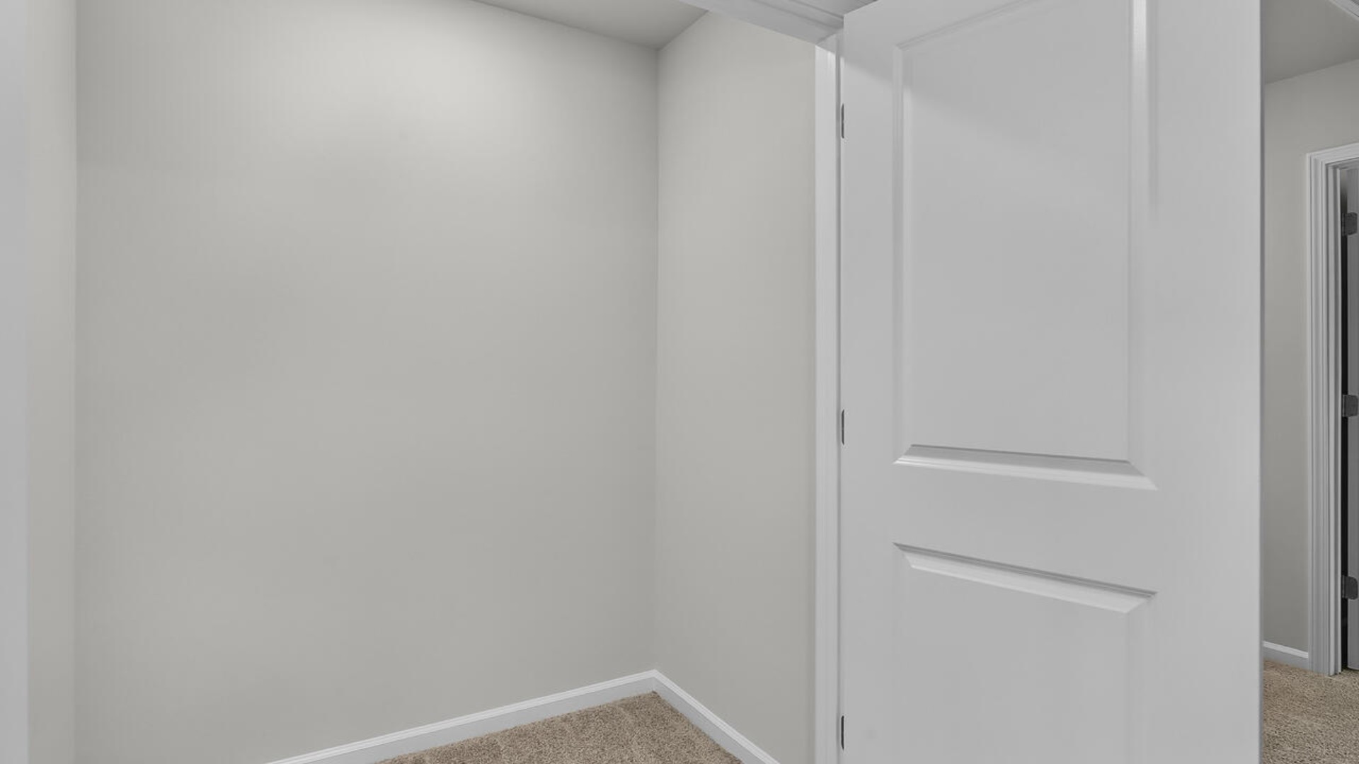 The second floor features the primary bedroom with a walk-in closet and double vanities. It also includes two additional bedrooms, a shared bathroom, and a laundry room for convenience.