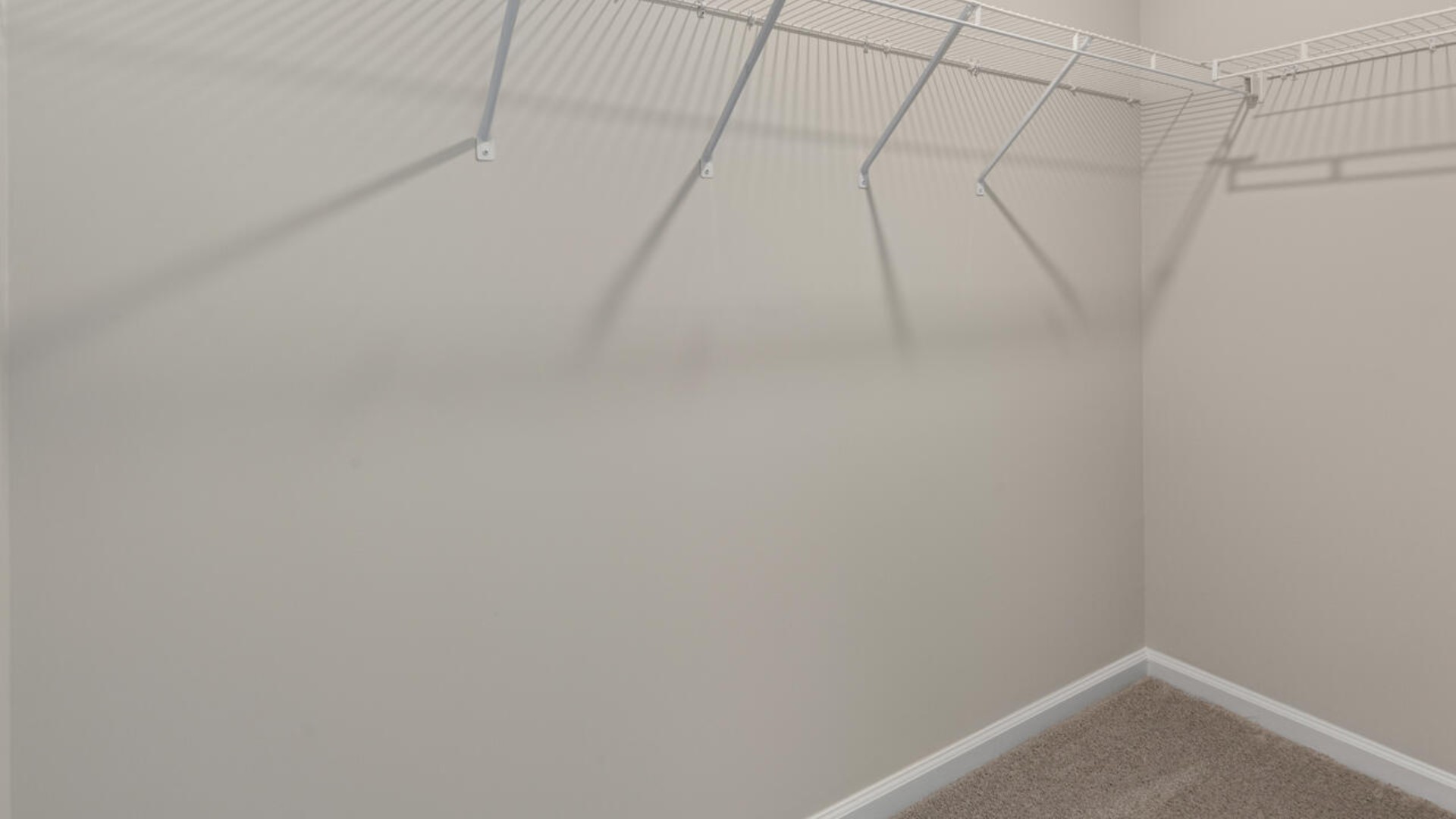 The second floor features the primary bedroom with a walk-in closet and double vanities