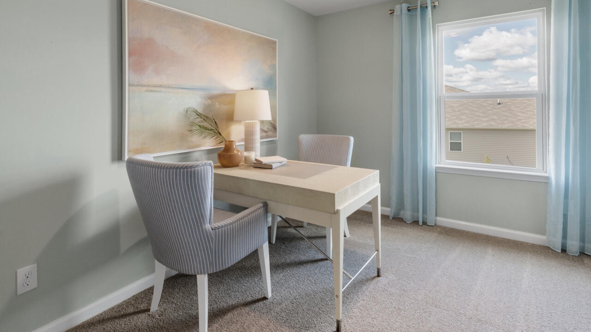 It also includes two additional bedrooms, a shared bathroom, and a laundry room for convenience.