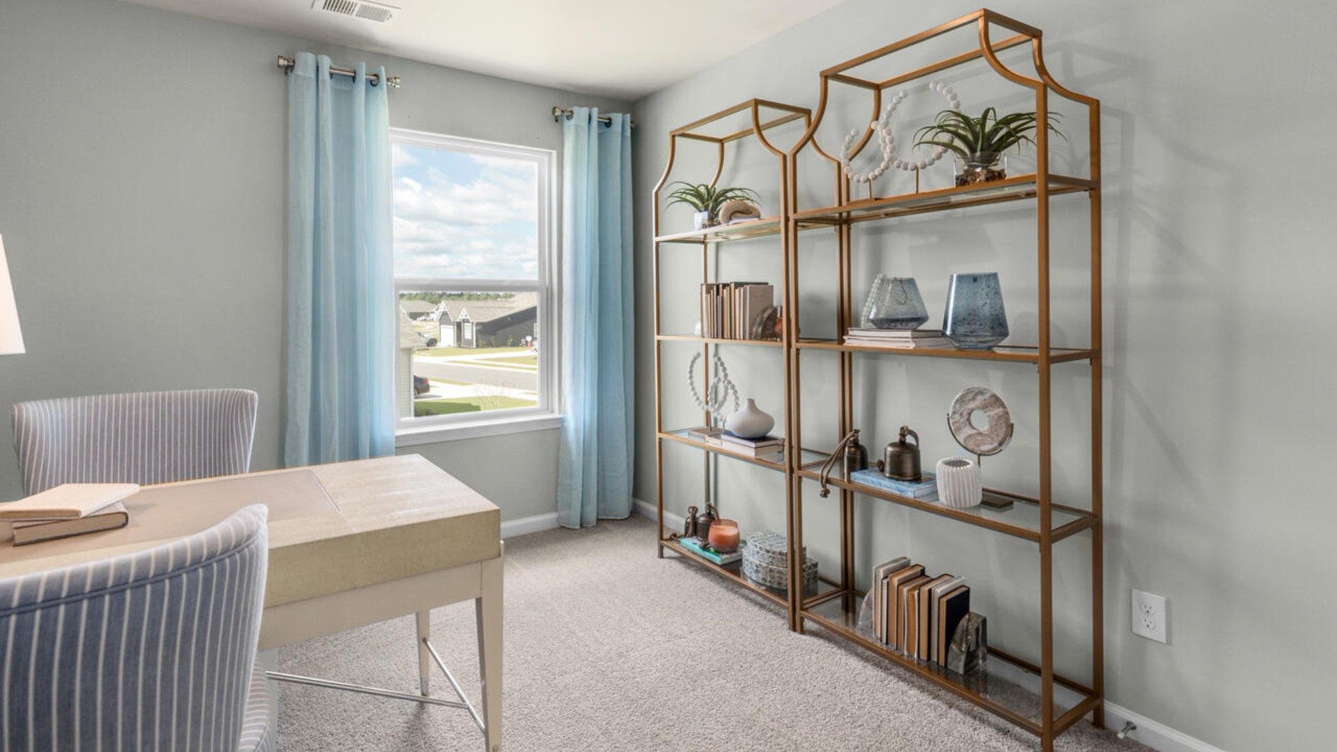 It also includes two additional bedrooms, a shared bathroom, and a laundry room for convenience.