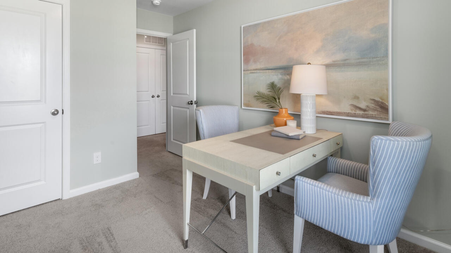 It also includes two additional bedrooms, a shared bathroom, and a laundry room for convenience.