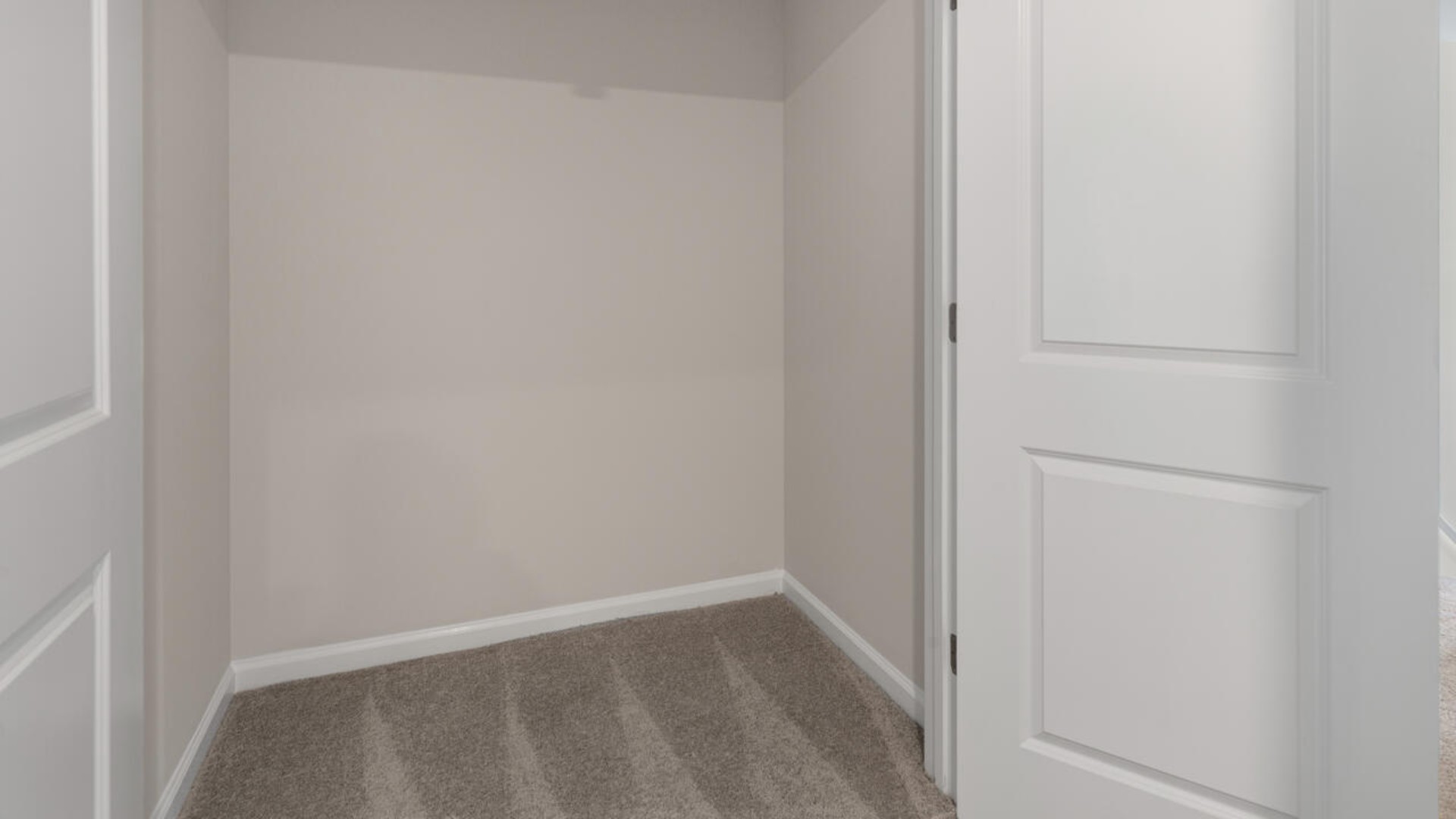 It also includes two additional bedrooms, a shared bathroom, and a laundry room for convenience.