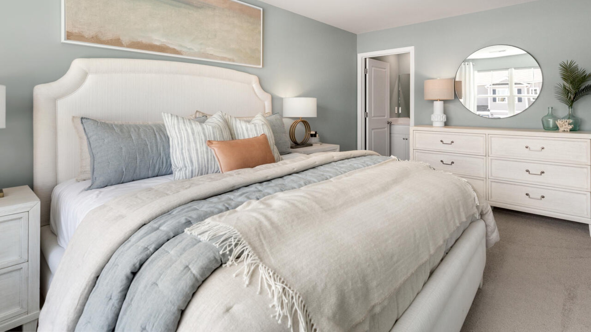 The second floor features the primary bedroom with a walk-in closet and double vanities