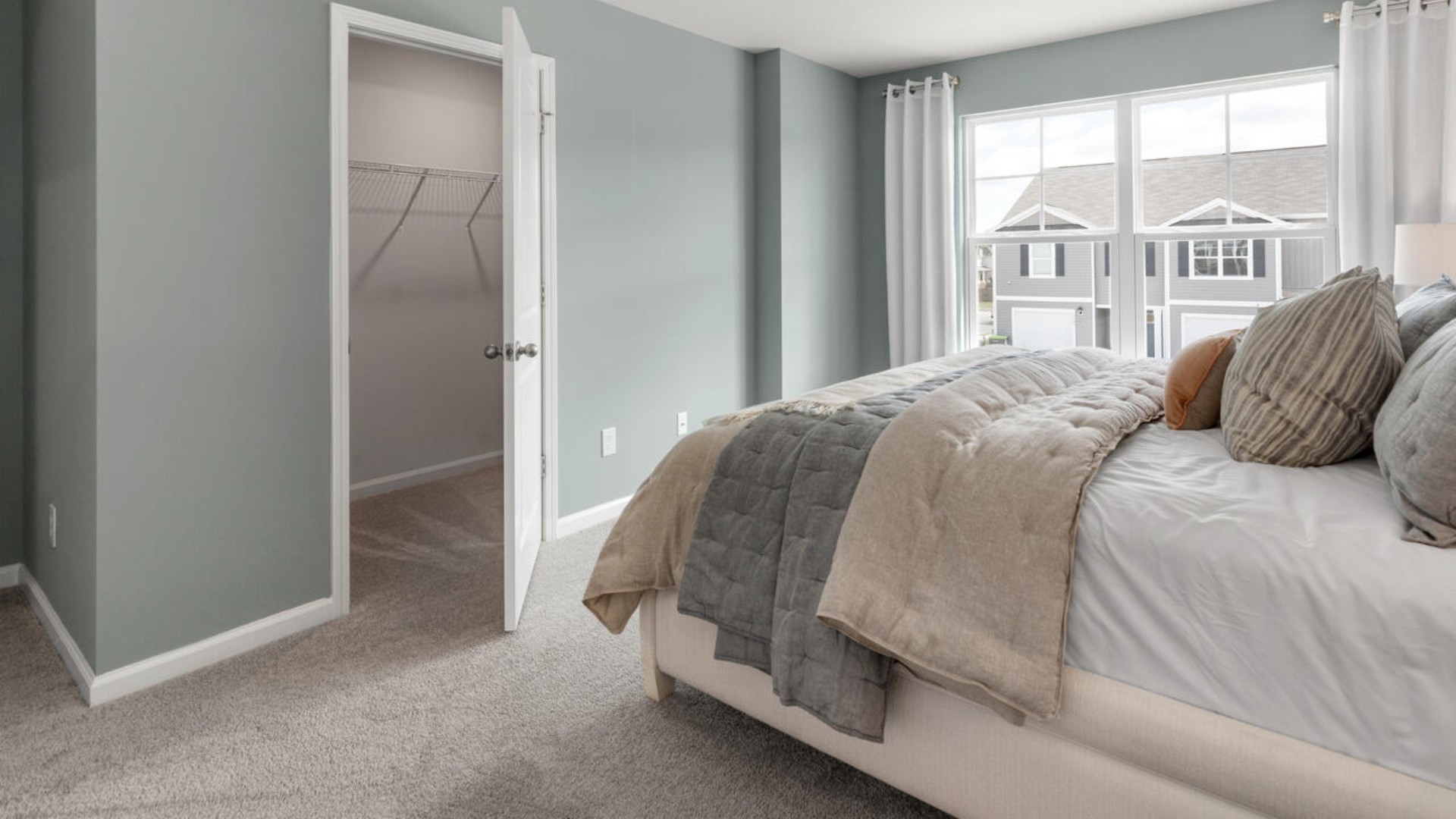 The second floor features the primary bedroom with a walk-in closet and double vanities