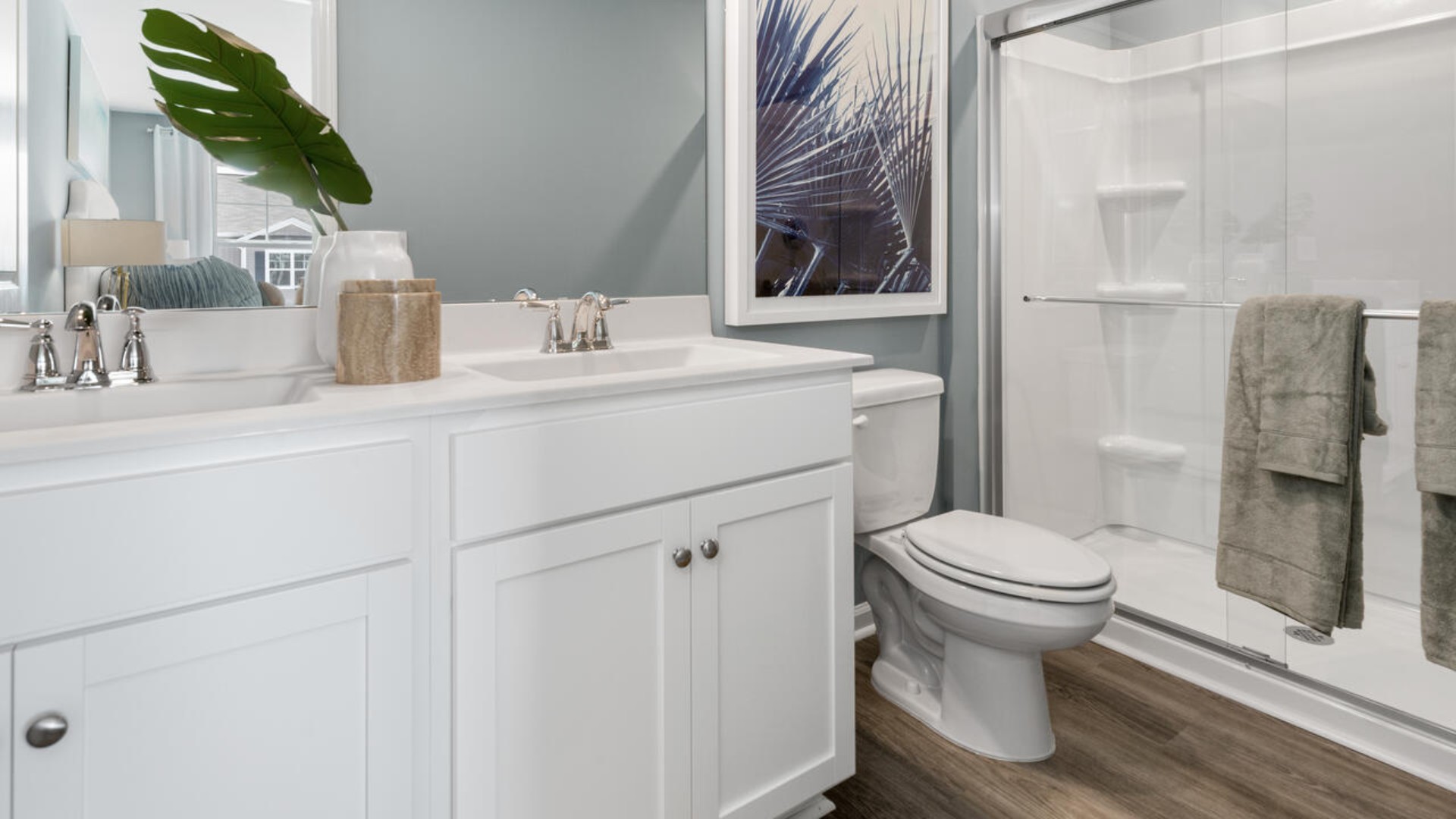 The second floor features the primary bedroom with a walk-in closet and double vanities