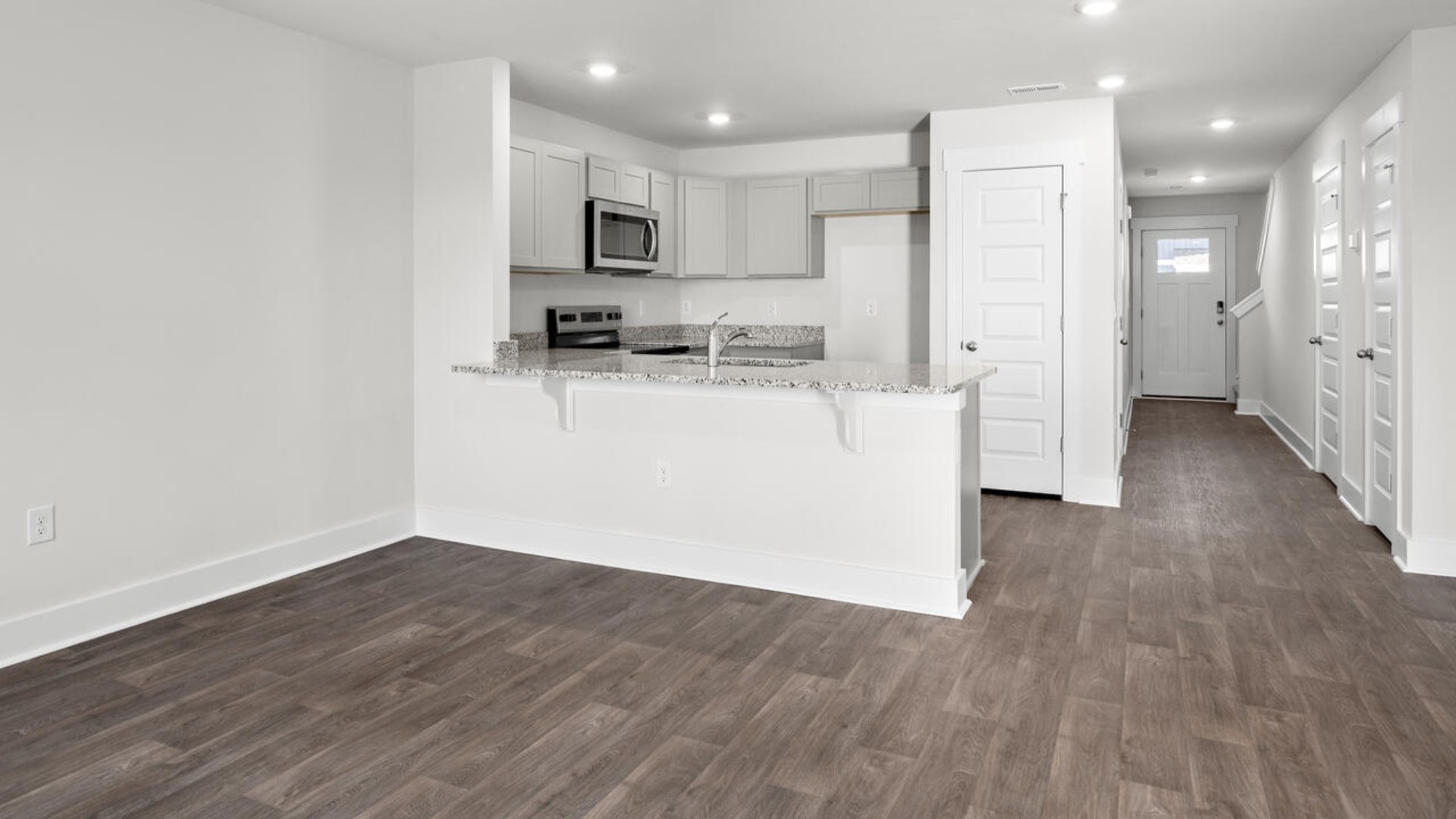 The kitchen overlooks the dining and living spaces, ideal for entertaining guests or enjoying family time while preparing meals with new stainless-steel appliances, walk-in pantry and granite countertops. You’ll love the open concept design, never too far from the action with the living and dining area right there.