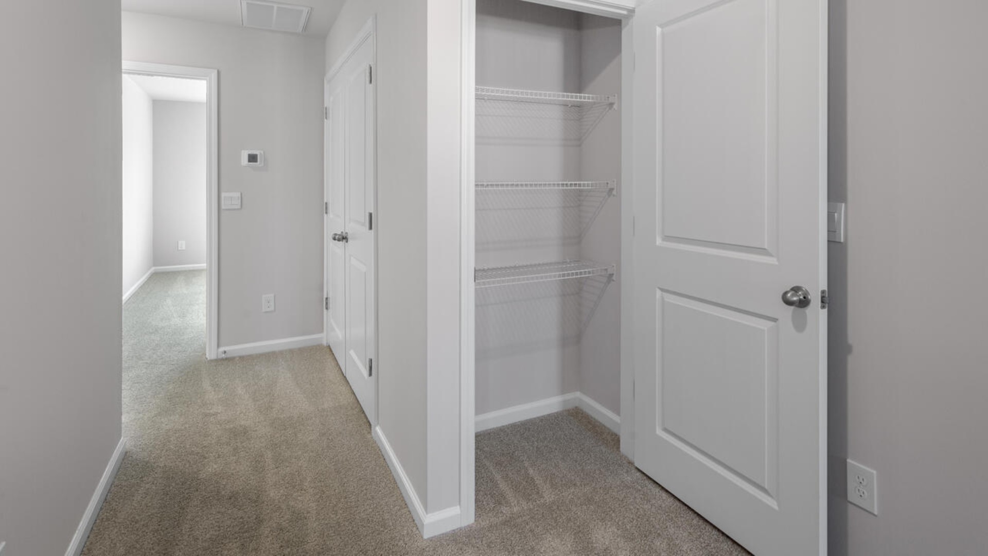 The second floor features the primary bedroom with a walk-in closet and double vanities