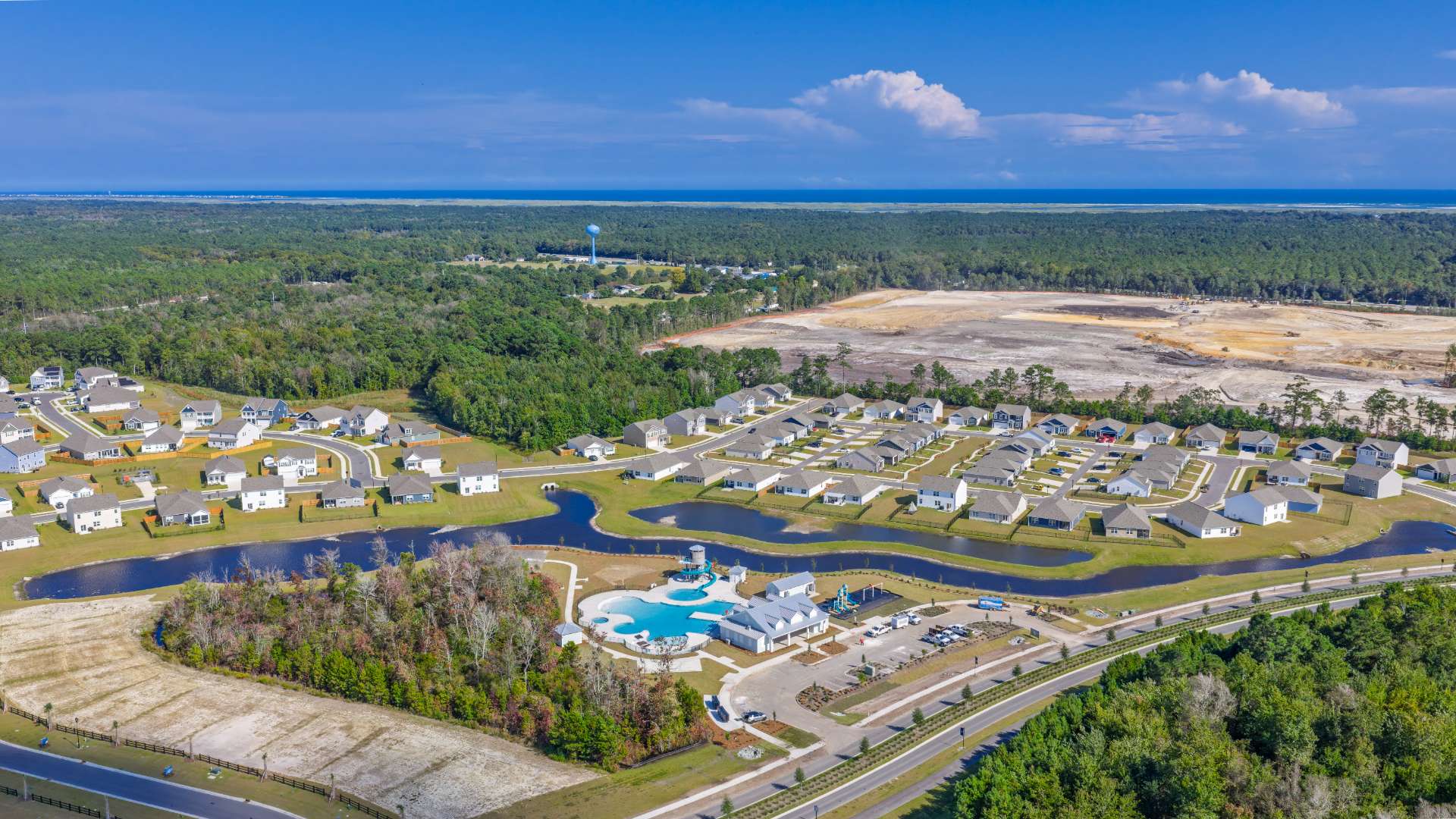 The Amenity Center will include a resort-style pool, clubhouse with kitchen, splash pad, waterslide, playground, pickleball, grill area, outdoor kitchen and fire pit.