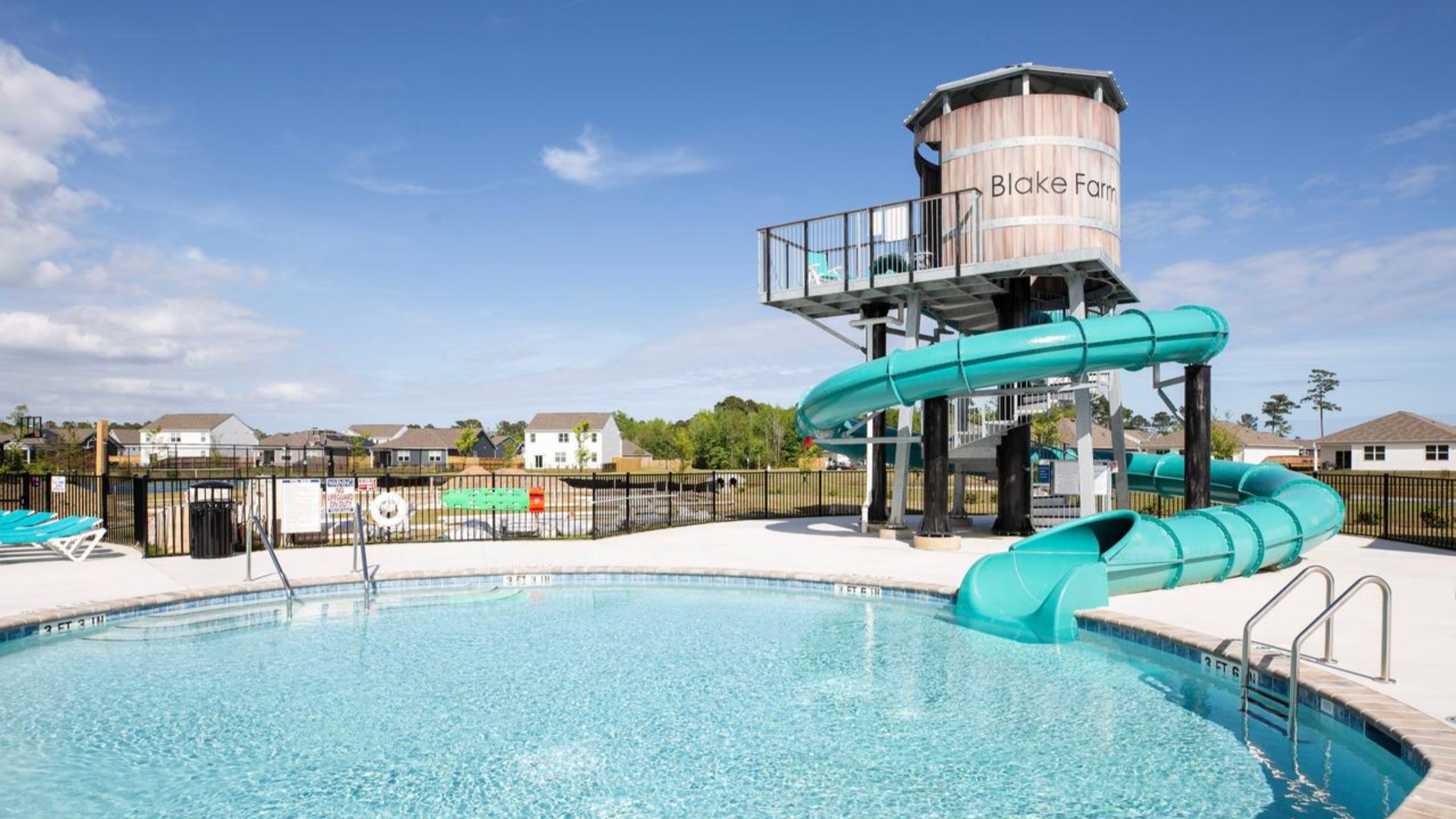 The Amenity Center includes a resort-style pool, clubhouse with kitchen, splash pad, waterslide, playground, pickleball, grill area, outdoor kitchen and fire pit.